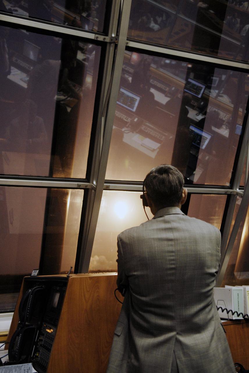 CAPE CANAVERAL, Fla. – In Firing Room 4 of the Launch Control Center at NASA's Kennedy Space Center in Florida, Center Director Bob  Cabana watches the brilliant launch of space shuttle Discovery on the STS-119 mission.  Launch was on time at 7:43 p.m. EDT. The STS-119 mission is the 28th to the space station and Discovery's 36th flight.  Discovery will deliver the final pair of power-generating solar array wings and the S6 truss segment.  Installation of S6 will signal the station's readiness to house a six-member crew for conducting increased science.  Photo credit: NASA/Kim Shiflett
