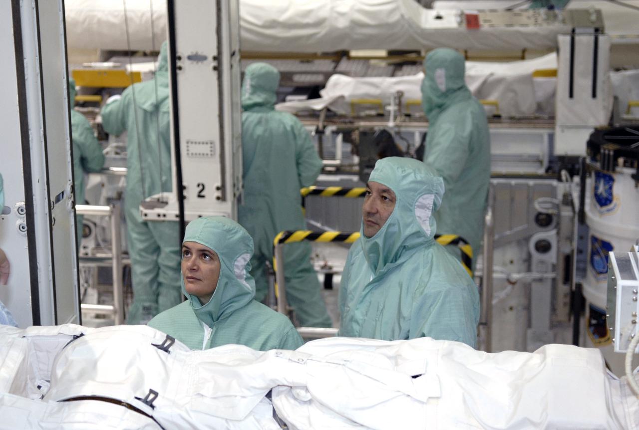 CAPE CANAVERAL, Fla. – In the Orbiter Processing Facility at NASA's Kennedy Space Center in Florida, STS-127 Mission Specialist Julie Payette (left) and Commander Mark Polansky get a close look at installed hardware in space shuttle Endeavour's payload bay. The crew members are at Kennedy for a crew equipment interface test, which provides hands-on training and observation of shuttle and flight hardware. Endeavour will deliver the Japanese Experiment Module's Experiment Logistics Module-Exposed Section, or ELM-ES, to the International Space Station on STS-127. Launch is targeted for mid-June, 2009. Photo credit: NASA/Kim Shiflett