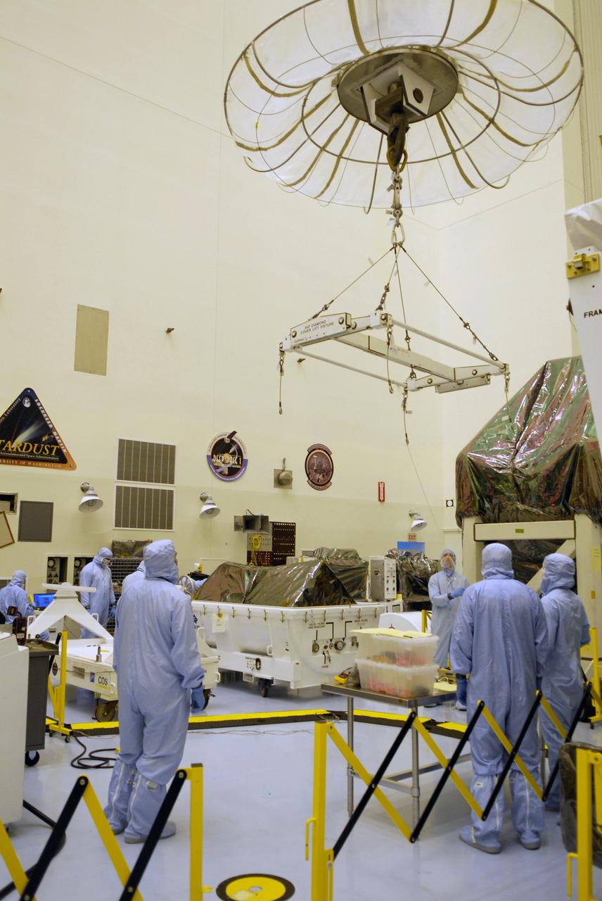 CAPE CANAVERAL, Fla. – In the Payload Hazardous Servicing Facility at NASA's Kennedy Space Center in Florida, a crane is moved to the shipping container with the Cosmic Origins Spectrograph, or COS, inside. The crane will remove the COS and place it on a test stand. The COS is part of the payload on space shuttle Atlantis for the Hubble servicing mission, targeted to launch in mid-May. Installing the COS during the mission will effectively restore spectroscopy to Hubble’s scientific arsenal, and at the same time provide the telescope with unique capabilities. COS is designed to study the large-scale structure of the universe and how galaxies, stars and planets formed and evolved. It will help determine how elements needed for life such as carbon and iron first formed and how their abundances have increased over the lifetime of the universe. Photo credit: NASA/Jack Pfaller