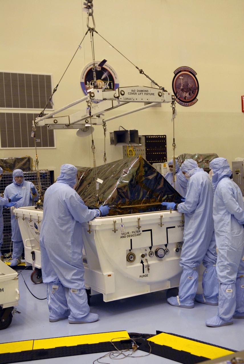 CAPE CANAVERAL, Fla. – In the Payload Hazardous Servicing Facility at NASA's Kennedy Space Center in Florida, a crane is attached to the Cosmic Origins Spectrograph, or COS, still in its shipping container. The crane will remove the COS and place it on a test stand. The COS is part of the payload on space shuttle Atlantis for the Hubble servicing mission, targeted to launch in mid-May. Installing the COS during the mission will effectively restore spectroscopy to Hubble’s scientific arsenal, and at the same time provide the telescope with unique capabilities. COS is designed to study the large-scale structure of the universe and how galaxies, stars and planets formed and evolved. It will help determine how elements needed for life such as carbon and iron first formed and how their abundances have increased over the lifetime of the universe. Photo credit: NASA/Jack Pfaller