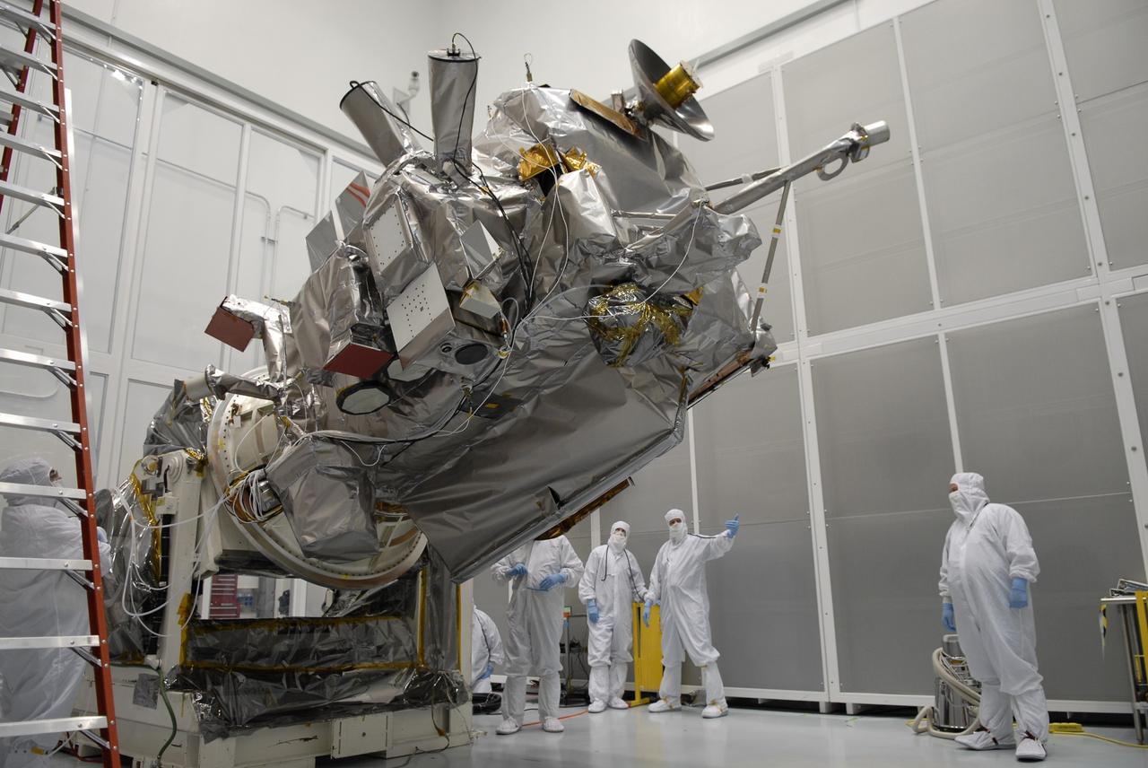 CAPE CANAVERAL, Fla. – At the Astrotech facility in Titusville, Fla., NASA's Lunar Reconnaissance Orbiter, or LRO, begins moving to a vertical position on the Aronson rotation stand. When vertical, a crane will be attached to move the LRO to another stand. The orbiter will carry seven instruments to provide scientists with detailed maps of the lunar surface and enhance our understanding of the moon's topography, lighting conditions, mineralogical composition and natural resources. Information gleaned from LRO will be used to select safe landing sites, determine locations for future lunar outposts and help mitigate radiation dangers to astronauts. The polar regions of the moon are the main focus of the mission because continuous access to sunlight may be possible and water ice may exist in permanently shadowed areas of the poles. Accompanying LRO on its journey to the moon will be the Lunar CRater Observation and Sensing Satellite, or LCROSS, a mission that will impact the lunar surface in its search for water ice. Launch of LRO is targeted for May 20. Photo credit: NASA/Kim Shiflett