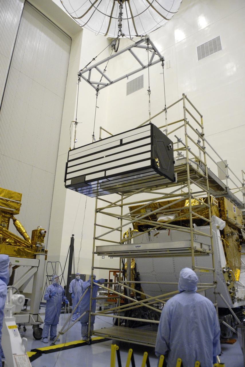 CAPE CANAVERAL, Fla. – In the Payload Hazardous Servicing Facility at NASA's Kennedy Space Center in Florida, a crane moves the Cosmic Origins Spectrograph, or COS, toward the Orbital Replacement Unit Carrier where it will be installed. The carrier will be placed in space shuttle Atlantis' payload bay for the Hubble servicing mission, STS-125, targeted to launch in mid-May. Installing the COS during the mission will effectively restore spectroscopy to Hubble’s scientific arsenal, and at the same time provide the telescope with unique capabilities. COS is designed to study the large-scale structure of the universe and how galaxies, stars and planets formed and evolved. It will help determine how elements needed for life such as carbon and iron first formed and how their abundances have increased over the lifetime of the universe. Photo credit: NASA/Kim Shiflett