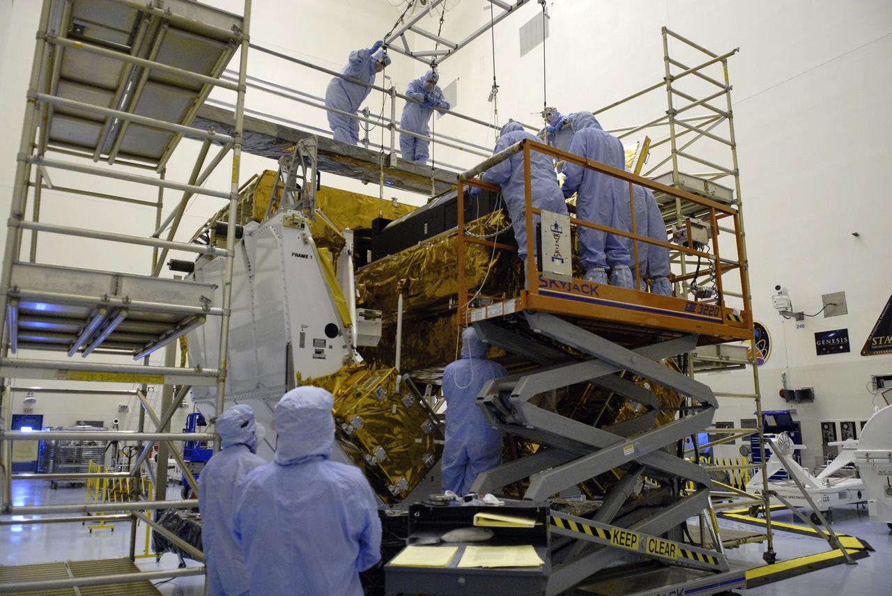 CAPE CANAVERAL, Fla. – In the Payload Hazardous Servicing Facility at NASA's Kennedy Space Center in Florida, technicians secure the Cosmic Origins Spectrograph, or COS, on the Orbital Replacement Unit Carrier. The carrier will be placed in space shuttle Atlantis' payload bay for the Hubble servicing mission, STS-125, targeted to launch in mid-May. Installing the COS during the mission will effectively restore spectroscopy to Hubble’s scientific arsenal, and at the same time provide the telescope with unique capabilities. COS is designed to study the large-scale structure of the universe and how galaxies, stars and planets formed and evolved. It will help determine how elements needed for life such as carbon and iron first formed and how their abundances have increased over the lifetime of the universe. Photo credit: NASA/Kim Shiflett