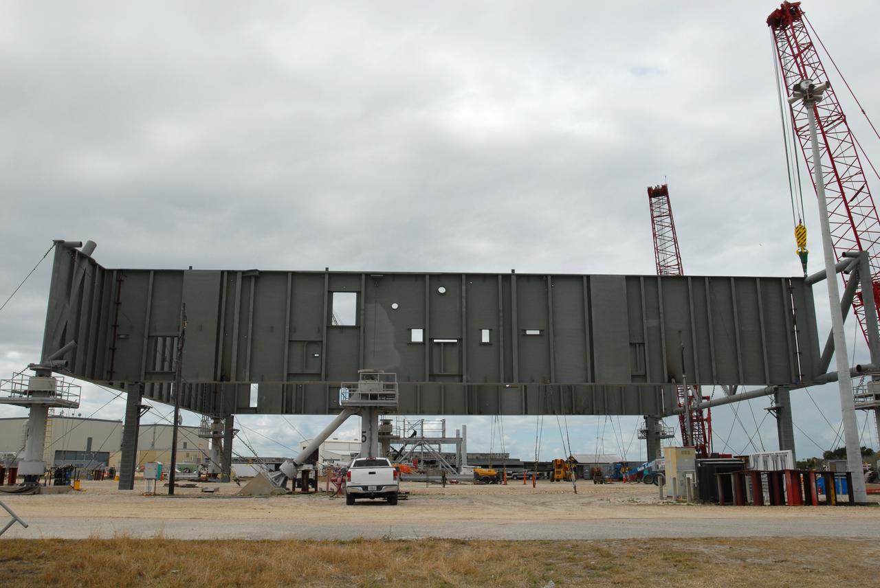 CAPE CANAVERAL, Fla. – At NASA's Kennedy Space Center in Florida, a new mobile launcher is under construction for the Constellation Program. The new mobile launcher will be the base for the Ares rockets to launch the Orion crew exploration vehicle and the cargo vehicle. The base is being made lighter than space shuttle mobile launcher platforms so the crawler-transporter can pick up the added load of the 345-foot tower and taller rocket. When the structural portion of the new launcher is complete, umbilicals, access arms, communications equipment and command/control equipment will be installed. Photo credit: NASA/Jim Grossmann