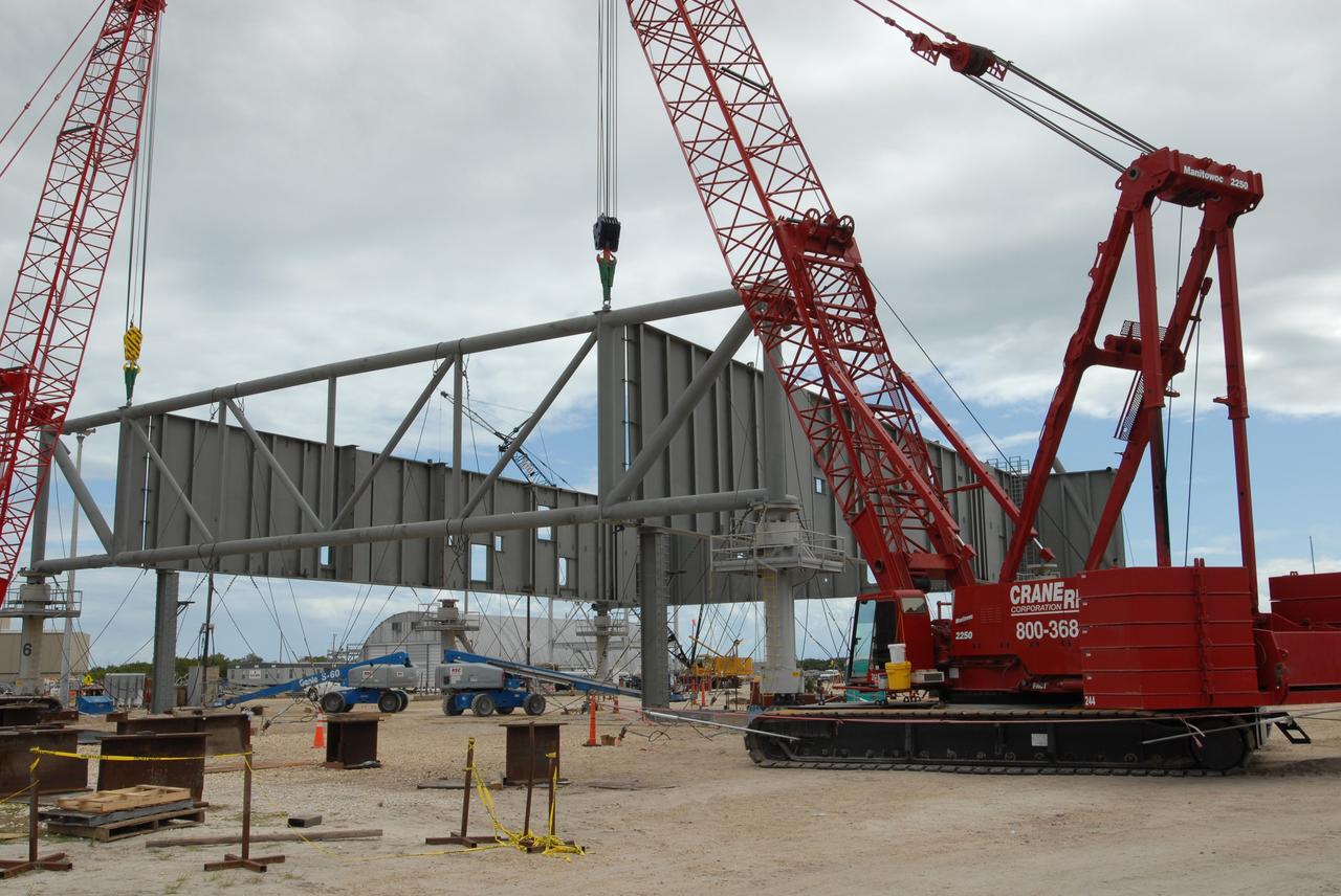 CAPE CANAVERAL, Fla. – At NASA's Kennedy Space Center in Florida, a new mobile launcher is under construction for the Constellation Program. The new mobile launcher will be the base for the Ares rockets to launch the Orion crew exploration vehicle and the cargo vehicle. The base is being made lighter than space shuttle mobile launcher platforms so the crawler-transporter can pick up the added load of the 345-foot tower and taller rocket. When the structural portion of the new launcher is complete, umbilicals, access arms, communications equipment and command/control equipment will be installed. Photo credit: NASA/Jim Grossmann