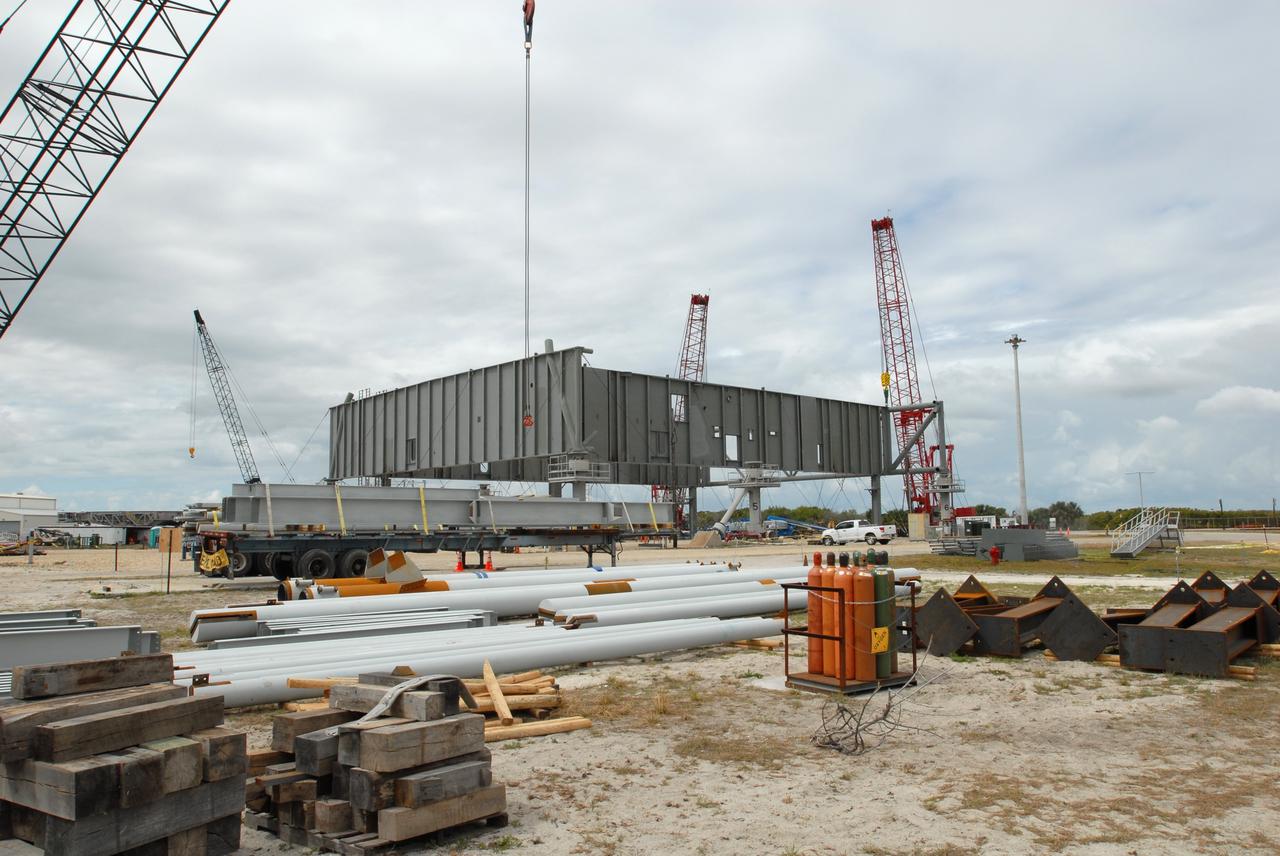 CAPE CANAVERAL, Fla. – At NASA's Kennedy Space Center in Florida, a new mobile launcher is under construction for the Constellation Program. The new mobile launcher will be the base for the Ares rockets to launch the Orion crew exploration vehicle and the cargo vehicle. The base is being made lighter than space shuttle mobile launcher platforms so the crawler-transporter can pick up the added load of the 345-foot tower and taller rocket. When the structural portion of the new launcher is complete, umbilicals, access arms, communications equipment and command/control equipment will be installed. Photo credit: NASA/Jim Grossmann