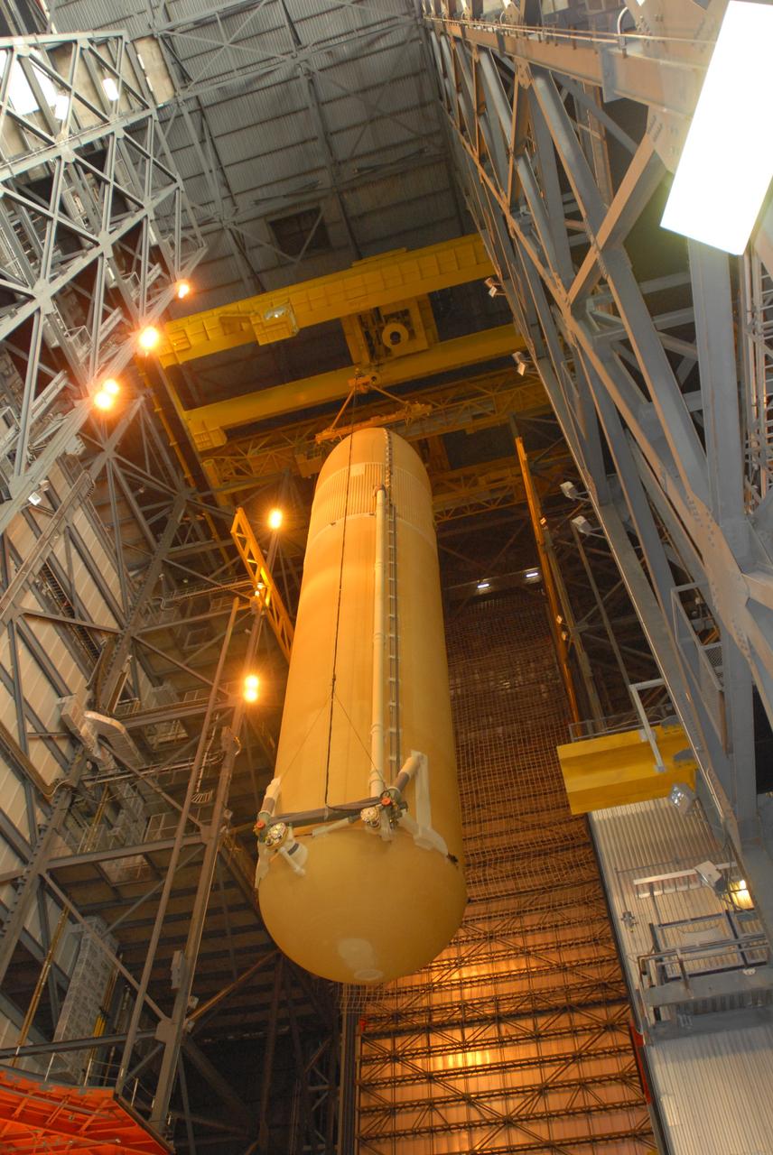 CAPE CANAVERAL, Fla. – In the Vehicle Assembly Building at NASA's Kennedy Space Center in Florida, space shuttle Endeavour's external fuel tank is lowered into high bay 1 for stacking with the solid rocket boosters on the mobile launcher platform. Endeavour is the launch vehicle for the STS-127 mission.   Endeavour will deliver the Japanese Experiment Module's Experiment Logistics Module-Exposed Section, or ELM-ES, to the International Space Station on STS-127. Launch is targeted for mid-June 2009. Photo credit: NASA/Jim Grossmann