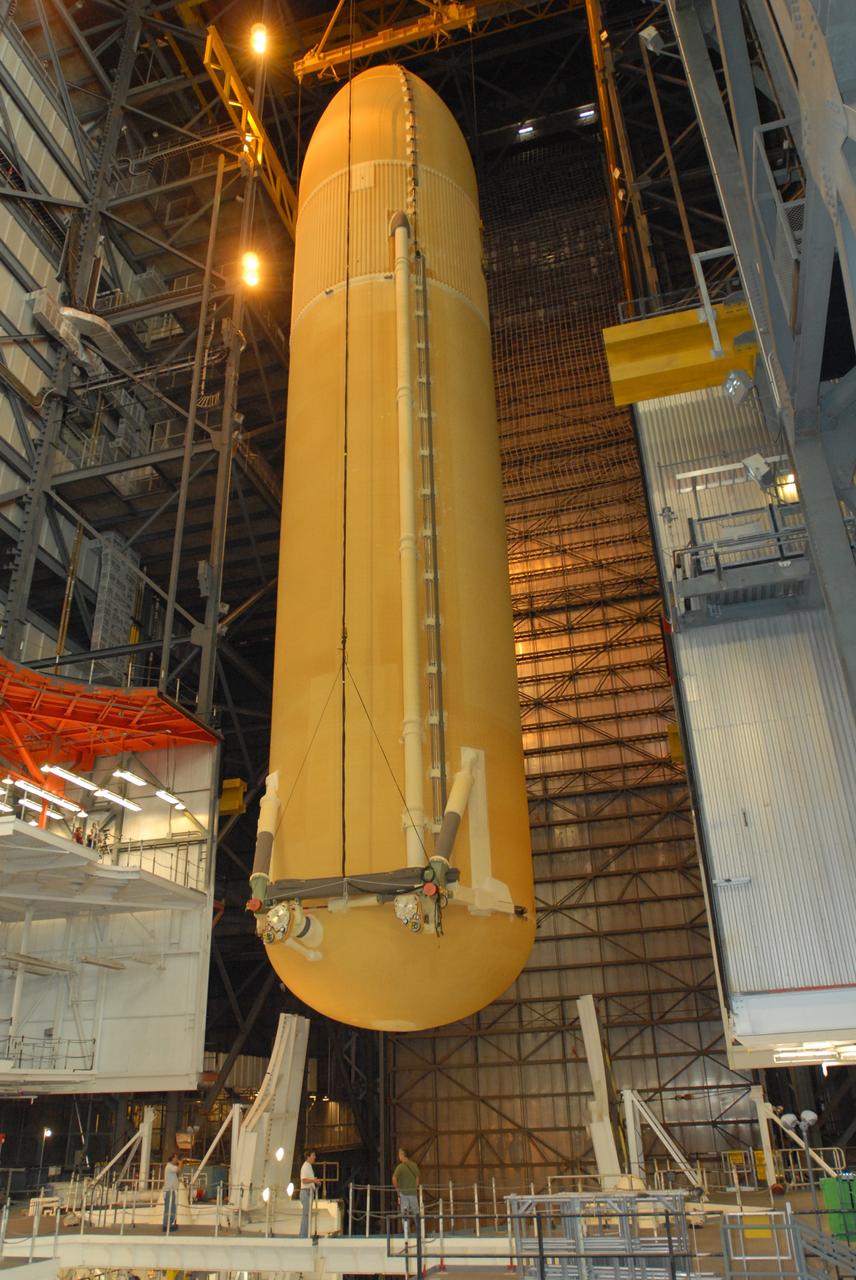 CAPE CANAVERAL, Fla. – In the Vehicle Assembly Building at NASA's Kennedy Space Center in Florida, space shuttle Endeavour's external fuel tank is lowered in high bay 1 between the solid rocket boosters on the mobile launcher platform. Endeavour is the launch vehicle for the STS-127 mission. Endeavour will deliver the Japanese Experiment Module's Experiment Logistics Module-Exposed Section, or ELM-ES, to the International Space Station on STS-127. Launch is targeted for mid-June 2009. Photo credit: NASA/Jim Grossmann