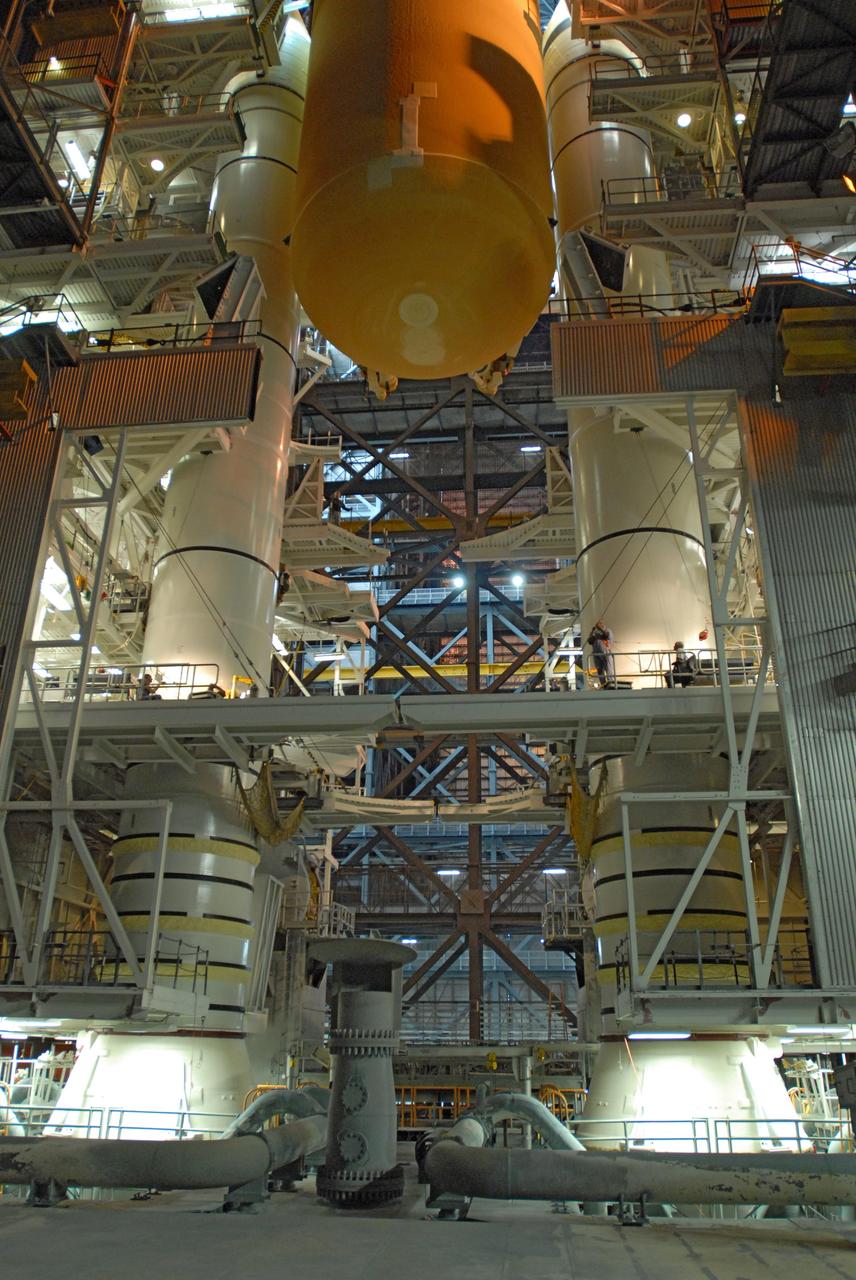 CAPE CANAVERAL, Fla. – In the Vehicle Assembly Building at NASA's Kennedy Space Center in Florida, space shuttle Endeavour's external fuel tank is lowered in high bay 1 between the solid rocket boosters on the mobile launcher platform. Endeavour is the launch vehicle for the STS-127 mission.   Endeavour will deliver the Japanese Experiment Module's Experiment Logistics Module-Exposed Section, or ELM-ES, to the International Space Station on STS-127. Launch is targeted for mid-June 2009. Photo credit: NASA/Jim Grossmann