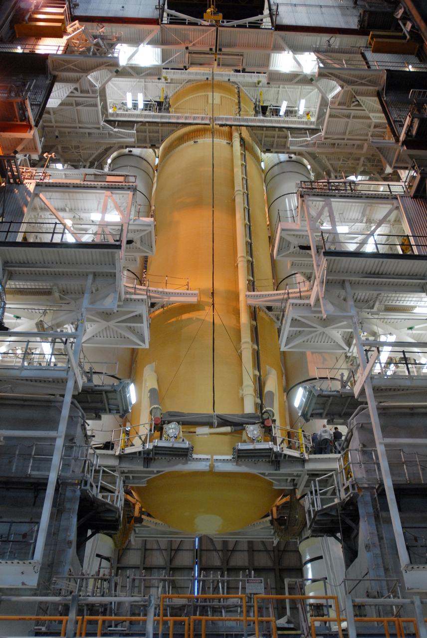 CAPE CANAVERAL, Fla. – In the Vehicle Assembly Building at NASA's Kennedy Space Center in Florida, space shuttle Endeavour's external fuel tank is lowered onto the mobile launcher platform in high bay 1 between the solid rocket boosters. Endeavour is the launch vehicle for the STS-127 mission.  Endeavour will deliver the Japanese Experiment Module's Experiment Logistics Module-Exposed Section, or ELM-ES, to the International Space Station on STS-127. Launch is targeted for mid-June 2009. Photo credit: NASA/Jim Grossmann