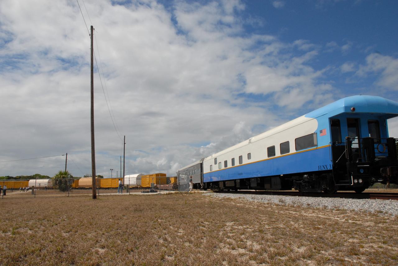 CAPE CANAVERAL, Fla. – The NASA Railroad makes the exchange with the Florida East Coast Railway cars carrying the booster segments for the Ares I-X test rocket. The four reusable motor segments and the nozzle exit cone, manufactured by the Ares I first-stage prime contractor Alliant Techsystems Inc., or ATK, departed Utah March 12 on the seven-day, cross-country trip to Florida.  The segments will be delivered to the  Rotation, Processing and Surge Facility for final processing and integration. The booster used for the Ares I-X launch is being modified by adding new forward structures and a fifth segment simulator. The motor is the final hardware needed for the rocket's upcoming test flight this summer. The stacking operations are scheduled to begin in the Vehicle Assembly Building in April.   Photo credit: NASA/Kim Shiflett