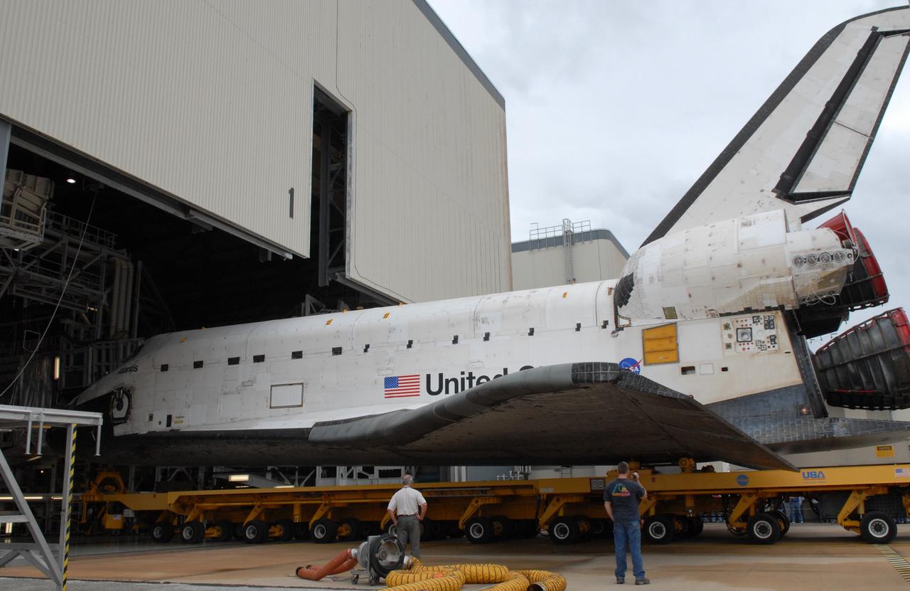 CAPE CANAVERAL, Fla. – Space shuttle Atlantis rolls out of Orbiter Processing Facility 1 at NASA's Kennedy Space Center in Florida to roll over to the Vehicle Assembly Building. First motion was at 11:30 a.m. EDT. In the VAB, Atlantis will be lifted into High Bay 3 and mated to the solid rocket booster-external fuel tank already installed on the mobile launcher platform. Atlantis is targeted to launch May 12 for the STS-125 Hubble servicing mission. Photo credit: NASA/Jack Pfaller