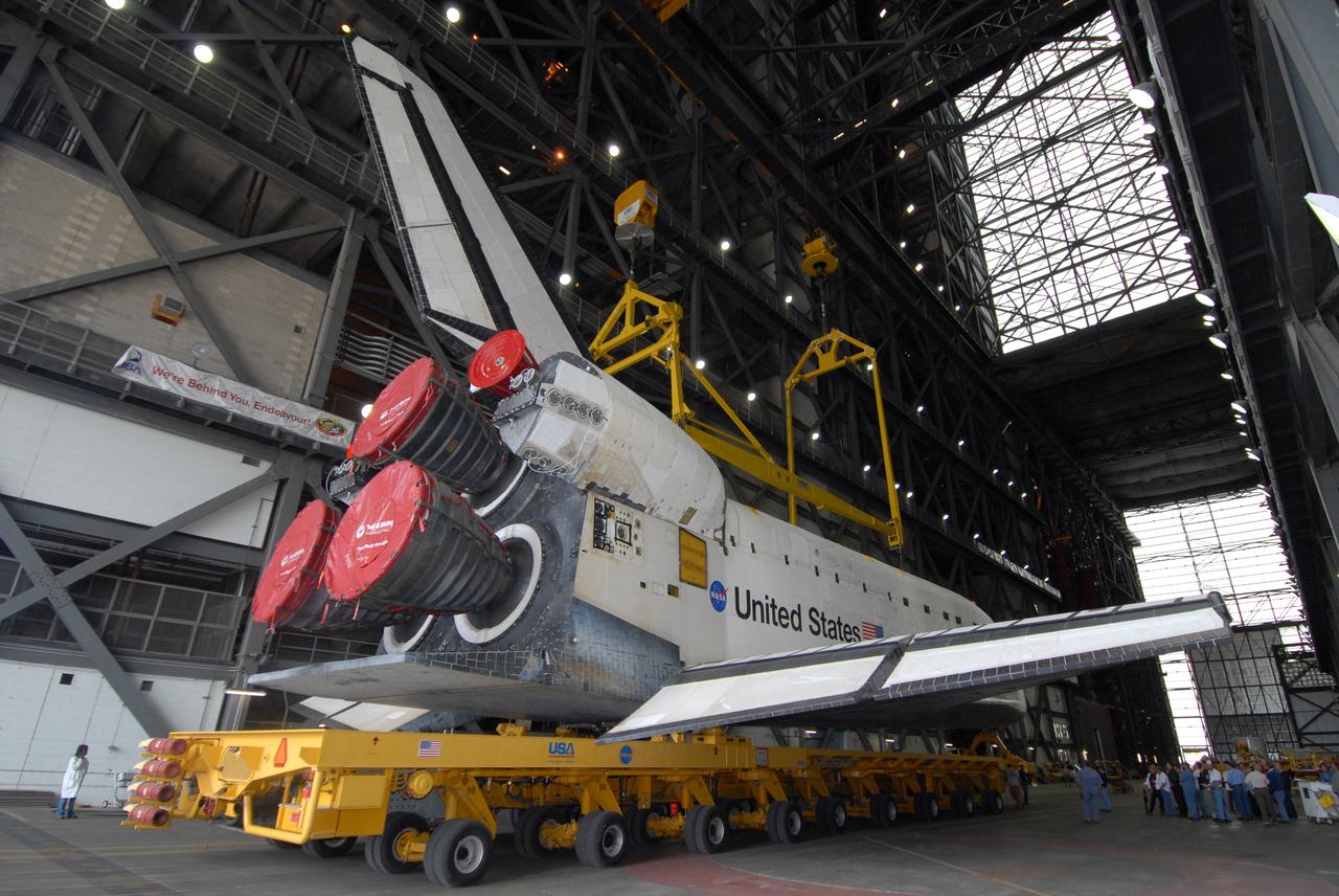 CAPE CANAVERAL, Fla. – Space shuttle Atlantis rolls into the transfer aisle of the Vehicle Assembly Building at NASA's Kennedy Space Center in Florida. First motion was at 11:30 a.m. EDT. From the transfer aisle, Atlantis will be lifted into High Bay 3 and mated to the solid rocket booster-external fuel tank already installed on the mobile launcher platform. Atlantis is targeted to launch May 12 for the STS-125 Hubble servicing mission. Photo credit: NASA/Jack Pfaller