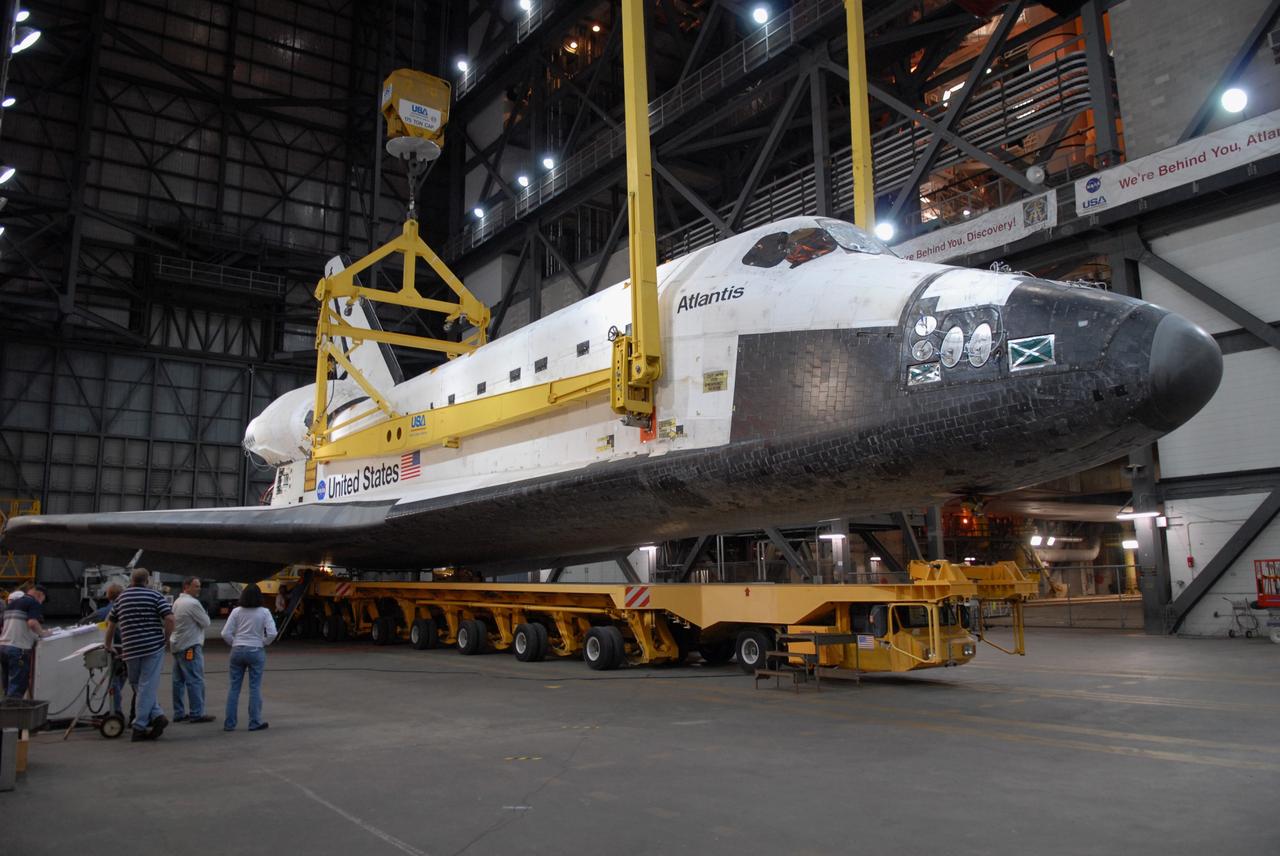 CAPE CANAVERAL, Fla. – In the Vehicle Assembly Building at NASA's Kennedy Space Center in Florida, space shuttle Atlantis is lifted off its transporter in the transfer aisle. The shuttle will be raised to a vertical position and lifted into High Bay 3 where it will be attached to its external fuel tank and solid rocket boosters on the mobile launcher platform. After additional preparations are made, the shuttle will be rolled out to Launch Pad 39A for a targeted launch on May 12 on the STS-125 Hubble servicing mission. Photo credit: NASA/Cory Huston