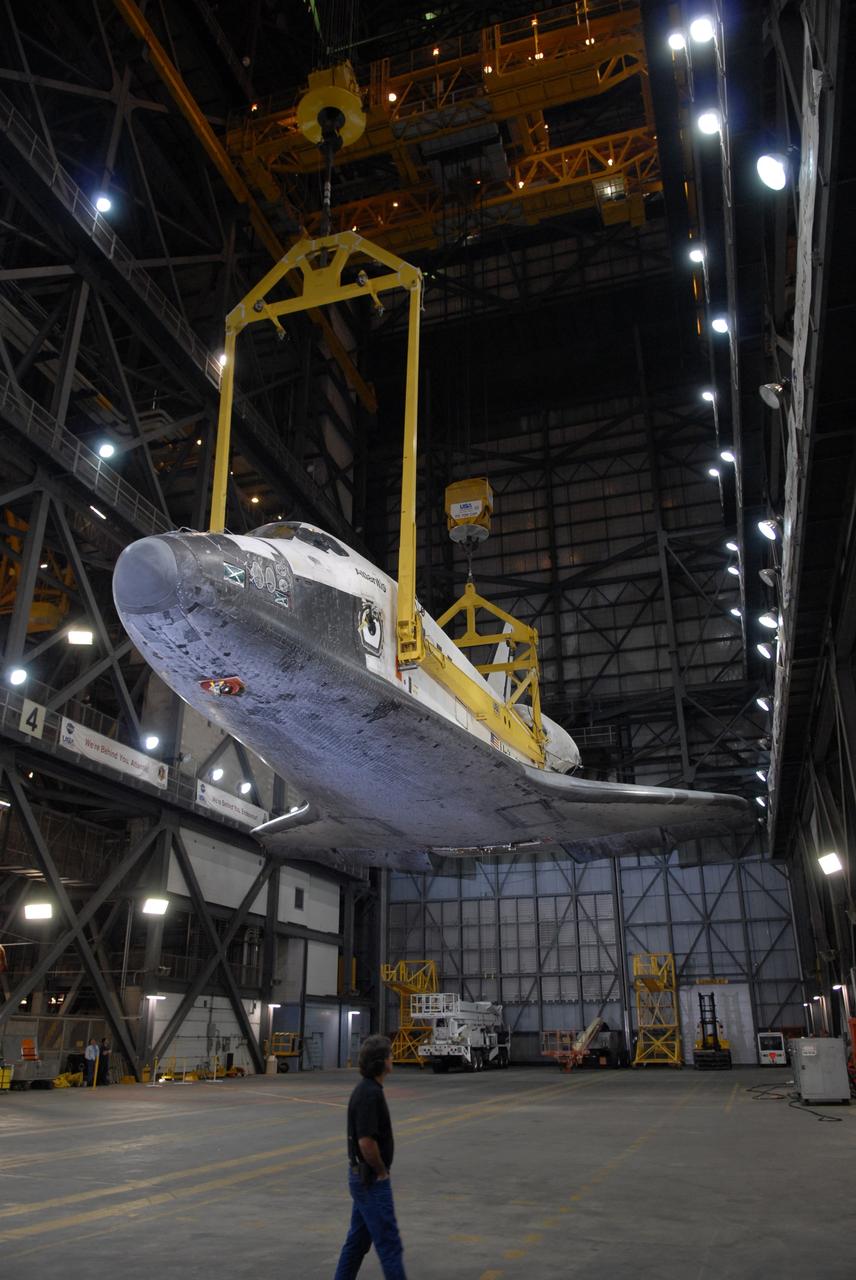 CAPE CANAVERAL, Fla. – In the Vehicle Assembly Building at NASA's Kennedy Space Center in Florida, space shuttle Atlantis is lifted higher above the transfer aisle. The shuttle will be rotated to a vertical position and lifted into High Bay 3 where it will be attached to its external fuel tank and solid rocket boosters on the mobile launcher platform. After additional preparations are made, the shuttle will be rolled out to Launch Pad 39A for a targeted launch on May 12 on the STS-125 Hubble servicing mission. Photo credit: NASA/Cory Huston
