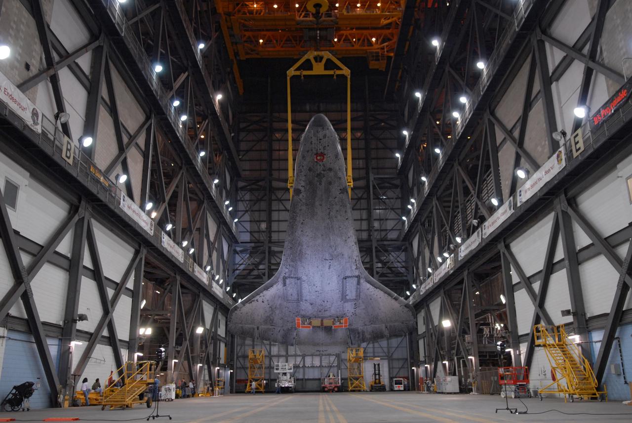 CAPE CANAVERAL, Fla. – In the Vehicle Assembly Building at NASA's Kennedy Space Center in Florida, space shuttle Atlantis is rotated by the crane toward a vertical position above the transfer aisle. The shuttle will be lifted into High Bay 3 where it will be attached to its external fuel tank and solid rocket boosters on the mobile launcher platform. After additional preparations are made, the shuttle will be rolled out to Launch Pad 39A for a targeted launch on May 12 on the STS-125 Hubble servicing mission. Photo credit: NASA/Cory Huston