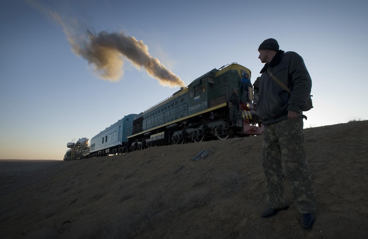 CAPE CANAVERAL, Fla. – A Russian security member monitors the railroad tracks as the Soyuz rocket rolls out to the launch pad March 24, 2009, at the Baikonur Cosmodrome in Kazakhstan.  The Soyuz is scheduled to launch the crew of Expedition 19 and a spaceflight participant on March 26, 2009.  Photo credit: NASA/Bill Ingalls