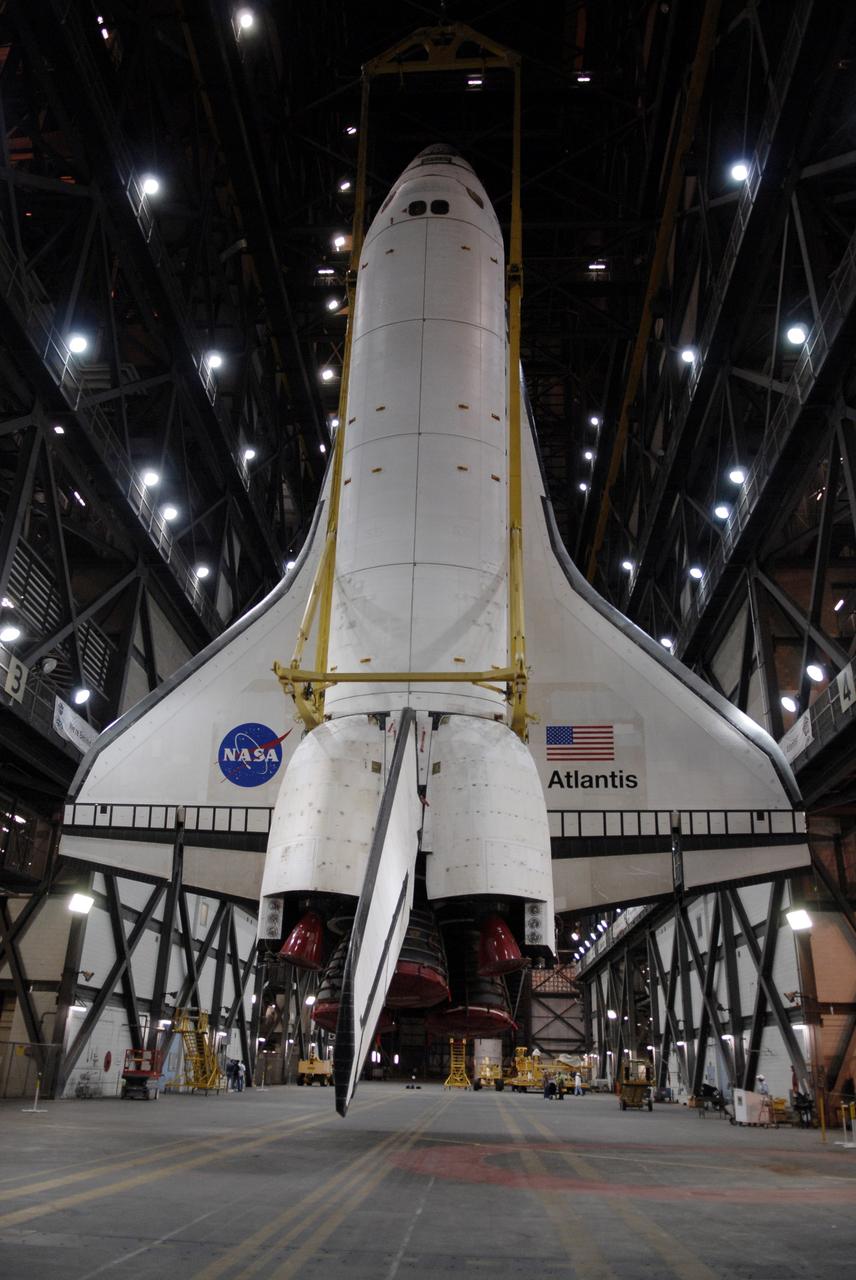 CAPE CANAVERAL, Fla. – After rotation in the Vehicle Assembly Building at NASA's Kennedy Space Center in Florida, space shuttle Atlantis is suspended vertically above the transfer aisle. The shuttle will be lifted into High Bay 3 where it will be lowered and mated with its external fuel tank and solid rocket boosters on the mobile launcher platform. After additional preparations are made, the shuttle will be rolled out to Launch Pad 39A for a targeted launch on May 12 on the STS-125 mission to service NASA's Hubble Space Telescope. Photo credit: NASA/Kim Shiflett