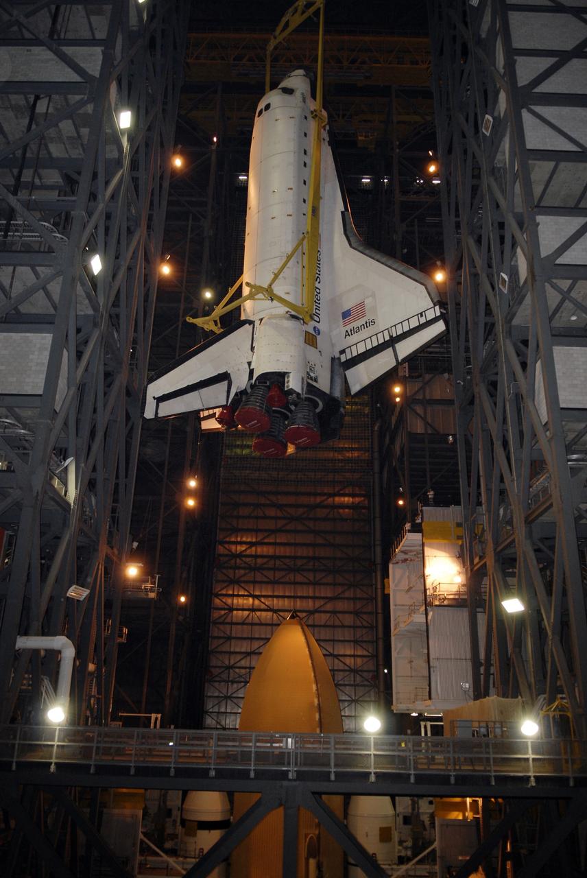 CAPE CANAVERAL, Fla. – In the Vehicle Assembly Building at NASA's Kennedy Space Center in Florida, space shuttle Atlantis is moved toward High Bay 3 where the top of its external fuel tank can be seen. In the bay, the shuttle will be lowered and mated with the external tank and solid rocket boosters on the mobile launcher platform. After additional preparations are made, the shuttle will be rolled out to Launch Pad 39A for a targeted launch on May 12 on the STS-125 mission to service NASA's Hubble Space Telescope. Photo credit: NASA/Kim Shiflett