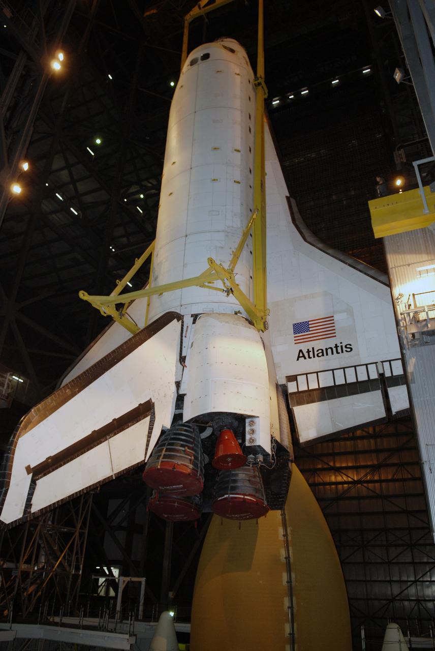 CAPE CANAVERAL, Fla. – In the Vehicle Assembly Building at NASA's Kennedy Space Center in Florida, space shuttle Atlantis is lowered alongside the external fuel tank in High Bay 3. In the bay, the shuttle will be mated with the external tank and solid rocket boosters on the mobile launcher platform. After additional preparations are made, the shuttle will be rolled out to Launch Pad 39A for a targeted launch on May 12 on the STS-125 mission to service NASA's Hubble Space Telescope. Photo credit: NASA/Kim Shiflett