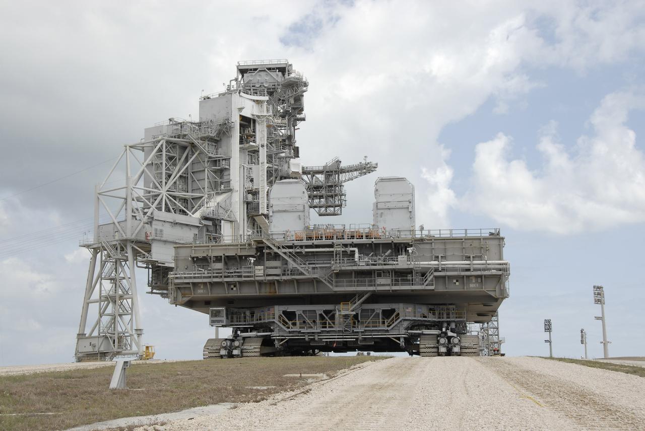 CAPE CANAVERAL, Fla. – Mobile Launcher Platform-1, on top of the crawler-transporter, reaches the top of Launch Pad 39B at NASA's Kennedy Space Center in Florida.  The MLP has been handed over to the Constellation Program for its future use for the Ares I-X flight test in the summer of 2009. Ares I-X is the test vehicle for the Ares I, which is part of the Constellation Program to return men to the moon and beyond.  Ground Control System hardware was installed in MLP-1 in December 2008.  The MLP is being moved to the launch pad to check out the installed hardware with the Launch Control Center Firing Room 1 equipment, using the actual circuits that will be used when the fully stacked Ares I-X vehicle is rolled out later this year for launch. Following this testing, MLP-1 will be moved to the Vehicle Assembly Building's High Bay 3 to begin stacking, or assembling, Ares I-X.  Photo credit: NASA/Kim Shiflett