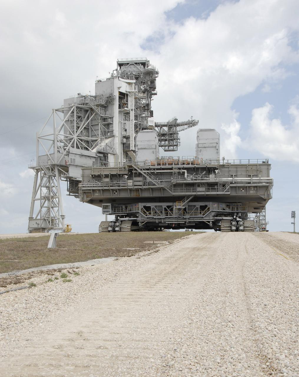 CAPE CANAVERAL, Fla. – Mobile Launcher Platform-1, on top of the crawler-transporter, reaches the top of Launch Pad 39B at NASA's Kennedy Space Center in Florida.  The MLP has been handed over to the Constellation Program for its future use for the Ares I-X flight test in the summer of 2009.  Ares I-X is the test vehicle for the Ares I, which is part of the Constellation Program to return men to the moon and beyond.  Ground Control System hardware was installed in MLP-1 in December 2008.  The MLP is being moved to the launch pad to check out the installed hardware with the Launch Control Center Firing Room 1 equipment, using the actual circuits that will be used when the fully stacked Ares I-X vehicle is rolled out later this year for launch. Following this testing, MLP-1 will be moved to the Vehicle Assembly Building's High Bay 3 to begin stacking, or assembling, Ares I-X.  Photo credit: NASA/Kim Shiflett