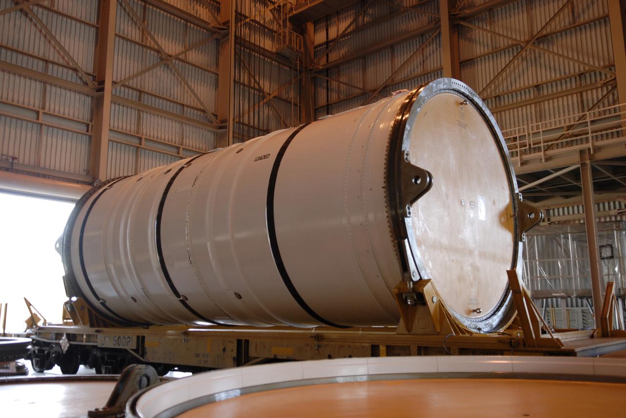 CAPE CANAVERAL, Fla. – In the Rotation, Processing and Surge Facility at NASA's Kennedy Space Center in Florida, the Ares I-X motor segment waits for inspection after removal of the shipping container. It is one of four reusable motor segments and nozzle exit cone shipped by the Ares I first-stage prime contractor Alliant Techsystems Inc. for final processing and integration in the facility. The booster used for the Ares I-X launch is being modified by adding new forward structures and a fifth segment simulator. The motor is the final hardware needed for the rocket's upcoming flight test this summer. The stacking operations are scheduled to begin in the Vehicle Assembly Building in April. Photo credit: NASA/Jim Grossmann