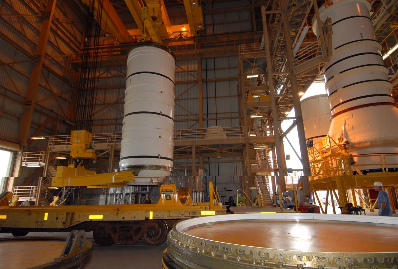 CAPE CANAVERAL, Fla. –  The Ares I-X motor segment is suspended vertically and ready to be moved to a work stand in the Rotation, Processing and Surge Facility at NASA's Kennedy Space Center in Florida. Four segments were delivered to Kennedy for final processing and integration. The booster used for the Ares I-X launch is being modified by adding new forward structures and a fifth segment simulator. The motor is the final hardware needed for the rocket's upcoming test flight this summer. The stacking operations are scheduled to begin in the Vehicle Assembly Building in April.  Photo credit: NASA/Jack Pfaller
