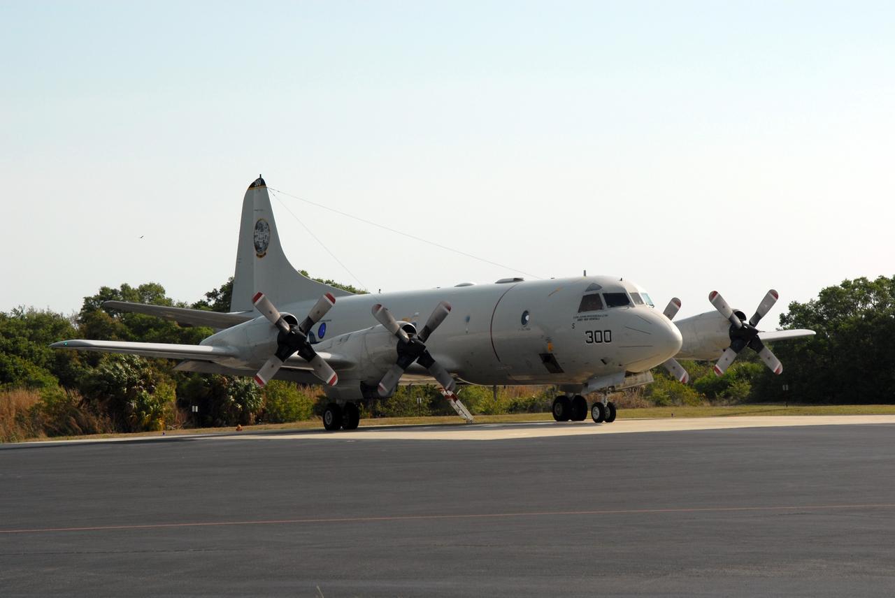 CAPE CANAVERAL, Fla. -- A U.S. Navy NP-3D Orion aircraft prepares for takeoff from the Skid Strip at Cape Canaveral Air Force Station. The plane will fly below space shuttle Discovery as it approaches Kennedy Space Center for landing following the STS-119 mission. Onboard instruments will check the orbiter’s exterior temperatures and a long-range infrared camera will remotely monitor heating to the shuttle’s lower surface, part of the boundary layer transition flight experiment. For the experiment, a heat shield tile with a “speed bump” on it was installed under Discovery’s left wing to intentionally disturb the airflow in a controlled manner and make the airflow turbulent. The tile, a BRI-18, was originally developed as a potential heat shield upgrade on the orbiters and is being considered for use on the Constellation Program’s Orion crew exploration vehicles. The data will determine if a protuberance on a BRI-18 tile is safe to fly and will be used to verify and improve design efforts for future spacecraft. Photo credit: NASA/Jim Grossmann