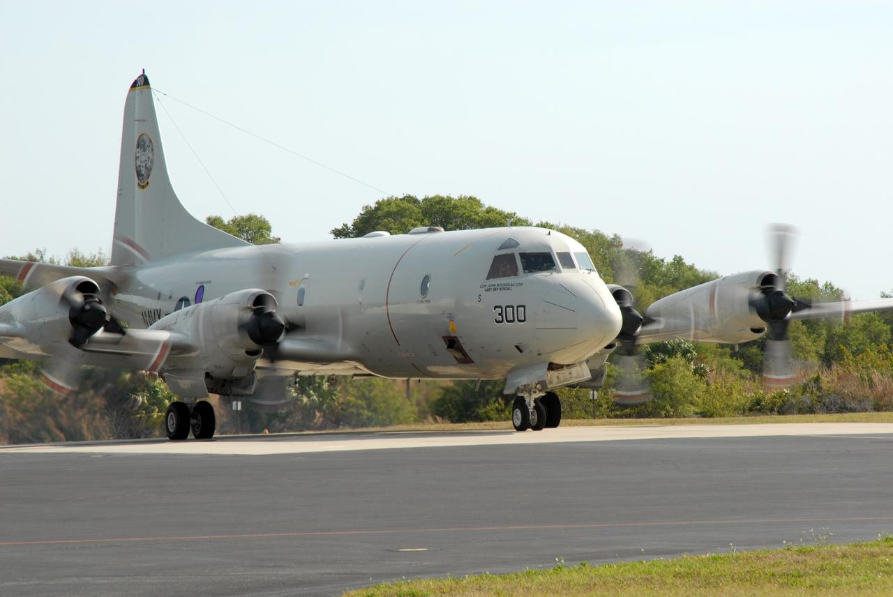 CAPE CANAVERAL, Fla. – The engines of U.S. Navy NP-3D Orion aircraft are started in preparation for takeoff from the Skid Strip at Cape Canaveral Air Force Station. The plane will fly below space shuttle Discovery as it approaches Kennedy Space Center for landing following the STS-119 mission. Onboard instruments will check the orbiter’s exterior temperatures and a long-range infrared camera will remotely monitor heating to the shuttle’s lower surface, part of the boundary layer transition flight experiment. For the experiment, a heat shield tile with a “speed bump” on it was installed under Discovery’s left wing to intentionally disturb the airflow in a controlled manner and make the airflow turbulent. The tile, a BRI-18, was originally developed as a potential heat shield upgrade on the orbiters and is being considered for use on the Constellation Program’s Orion crew exploration vehicles. The data will determine if a protuberance on a BRI-18 tile is safe to fly and will be used to verify and improve design efforts for future spacecraft. Photo credit: NASA/Jim Grossmann