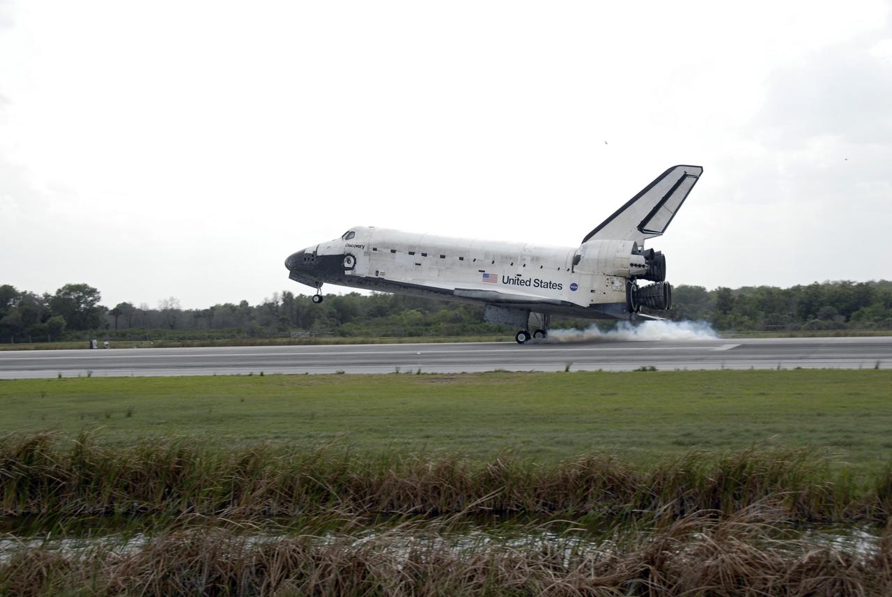 CAPE CANAVERAL, Fla. – Space shuttle Discovery touches down on Runway 15 at NASA's Kennedy Space Center in Florida to complete the 13-day, 5.3-million mile journey on the STS-119 mission to the International Space Station. Main gear touchdown was at 3:13:17 p.m. EDT. Nose gear touchdown was at 3:13:40 p.m. and wheels stop was at 3:14:45 p.m. Discovery delivered the final pair of large power-generating solar array wings and the S6 truss segment. The mission was the 28th flight to the station, the 36th flight of Discovery and the 125th in the Space Shuttle Program, as well as the 70th landing at Kennedy. Photo credit: NASA/Kim Shiflett