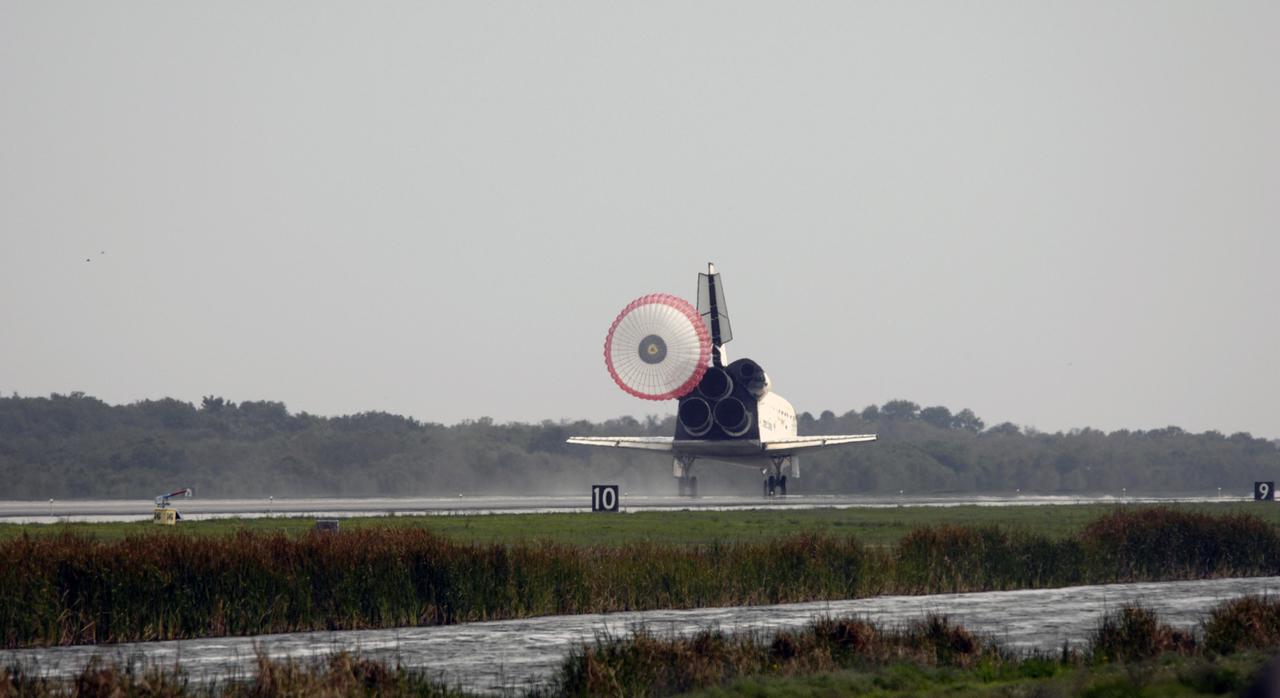 CAPE CANAVERAL, Fla. – With the aid of a drogue chute, space shuttle Discovery slows to a stop on Runway 15 at NASA's Kennedy Space Center in Florida to complete the 13-day, 5.3-million mile journey on the STS-119 mission to the International Space Station. Main gear touchdown was at 3:13:17 p.m. EDT. Nose gear touchdown was at 3:13:40 p.m. and wheels stop was at 3:14:45 p.m. Discovery delivered the final pair of large power-generating solar array wings and the S6 truss segment. The mission was the 28th flight to the station, the 36th flight of Discovery and the 125th in the Space Shuttle Program, as well as the 70th landing at Kennedy. Photo credit: NASA/Michael Kerley
