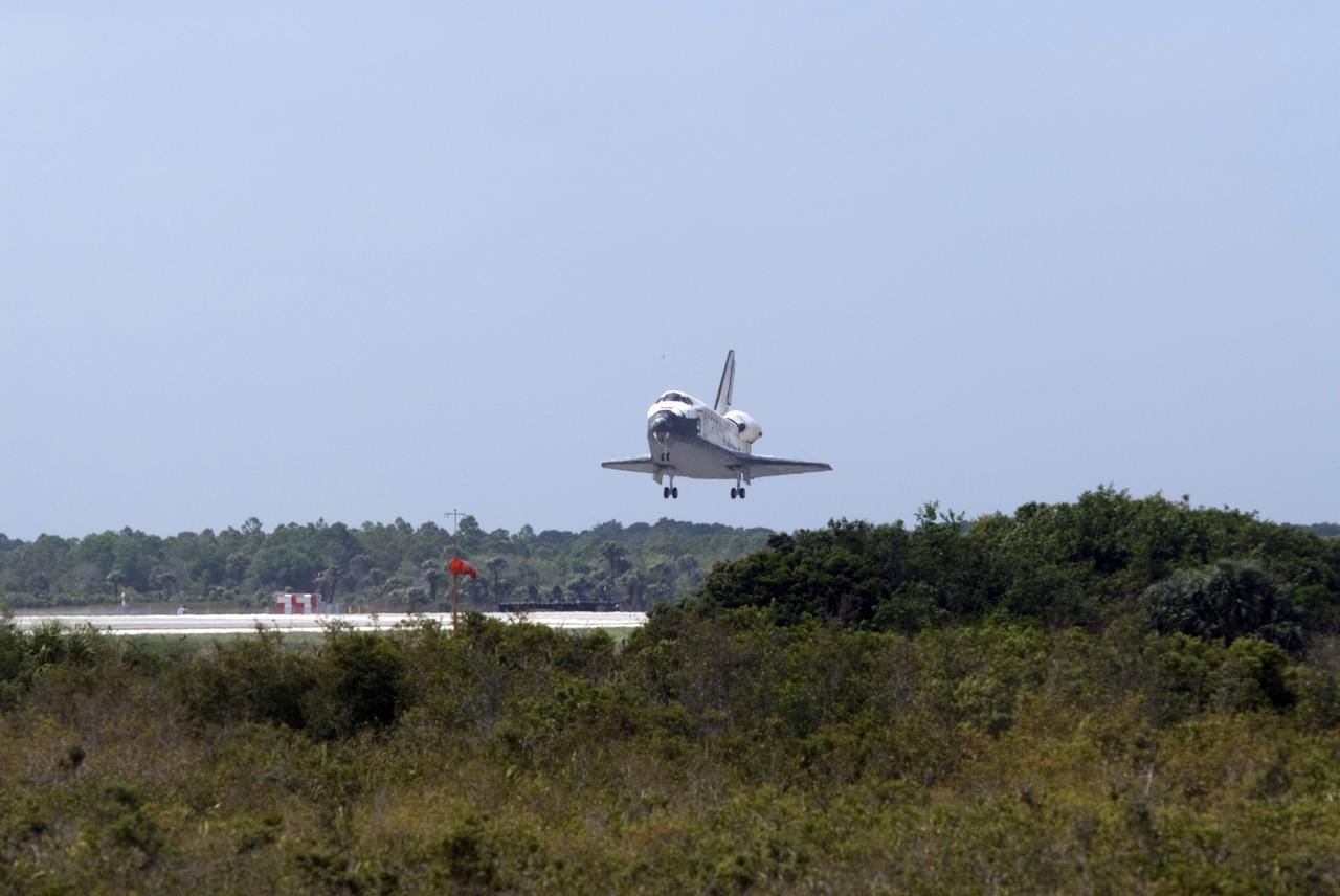 CAPE CANAVERAL, Fla. – Space shuttle Discovery approaches Runway 15 at NASA's Kennedy Space Center in Florida to complete the 13-day, 5.3-million mile journey on the STS-119 mission to the International Space Station. Main gear touchdown was at 3:13:17 p.m. EDT. Nose gear touchdown was at 3:13:40 p.m. and wheels stop was at 3:14:45 p.m. Discovery delivered the final pair of large power-generating solar array wings and the S6 truss segment. The mission was the 28th flight to the station, the 36th flight of Discovery and the 125th in the Space Shuttle Program, as well as the 70th landing at Kennedy. Photo credit: NASA/Rick Wetherington