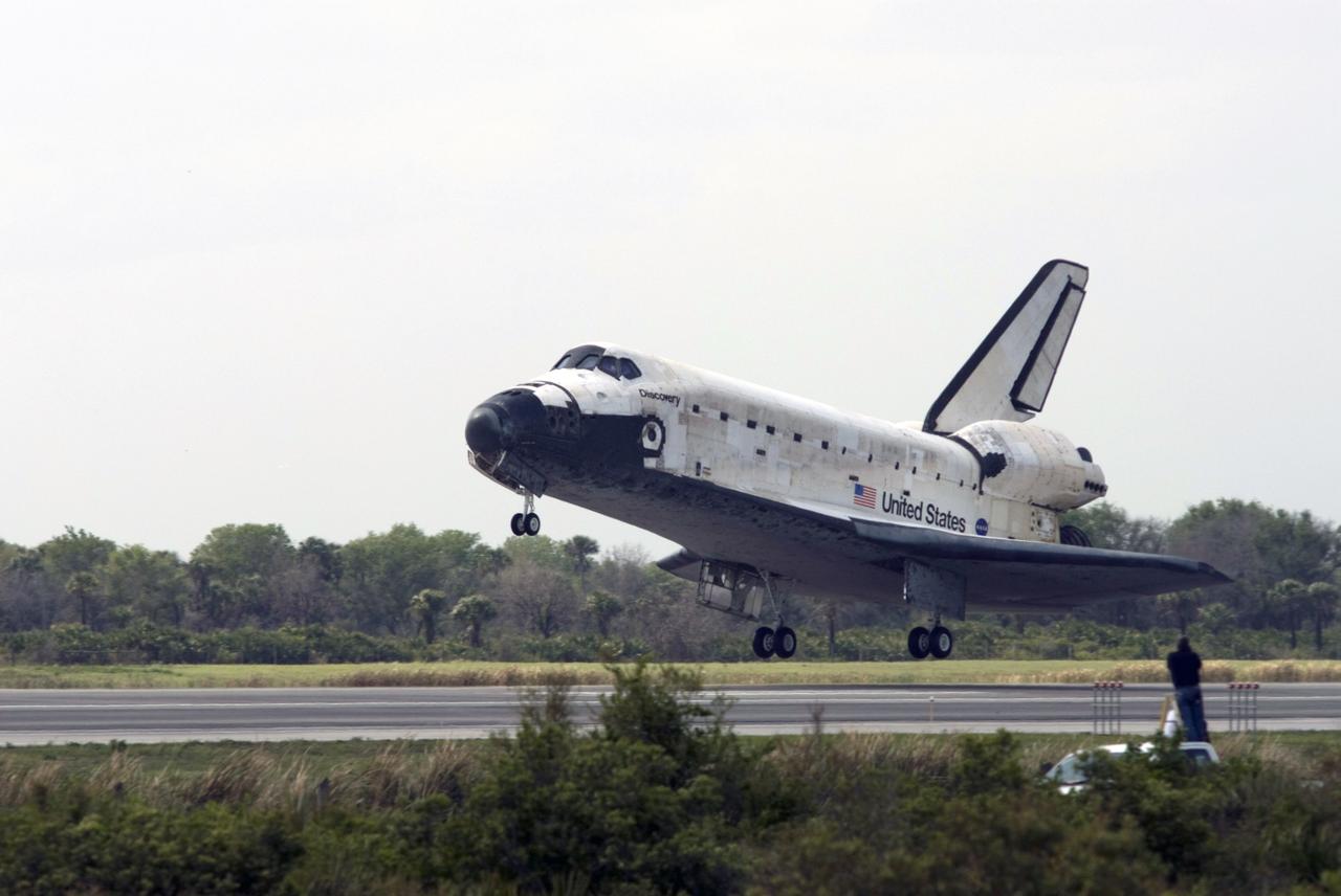 CAPE CANAVERAL, Fla. – Space shuttle Discovery nears touchown on Runway 15 at NASA's Kennedy Space Center in Florida to complete the 13-day, 5.3-million mile journey on the STS-119 mission to the International Space Station. Main gear touchdown was at 3:13:17 p.m. EDT. Nose gear touchdown was at 3:13:40 p.m. and wheels stop was at 3:14:45 p.m. Discovery delivered the final pair of large power-generating solar array wings and the S6 truss segment. The mission was the 28th flight to the station, the 36th flight of Discovery and the 125th in the Space Shuttle Program, as well as the 70th landing at Kennedy. Photo credit: NASA/Rick Wetherington