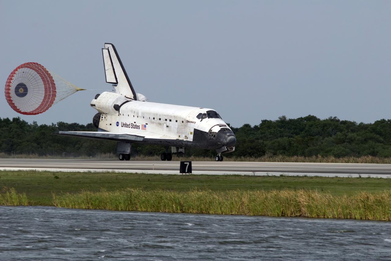 CAPE CANAVERAL, Fla. – With the aid of a drogue chute, space shuttle Discovery slows for landing on Runway 15 at NASA's Kennedy Space Center in Florida to complete the 13-day, 5.3-million mile journey on the STS-119 mission to the International Space Station. Main gear touchdown was at 3:13:17 p.m. EDT. Nose gear touchdown was at 3:13:40 p.m. and wheels stop was at 3:14:45 p.m. Discovery delivered the final pair of large power-generating solar array wings and the S6 truss segment. The mission was the 28th flight to the station, the 36th flight of Discovery and the 125th in the Space Shuttle Program, as well as the 70th landing at Kennedy. Photo credit: NASA/Tim Terry, Don Kight