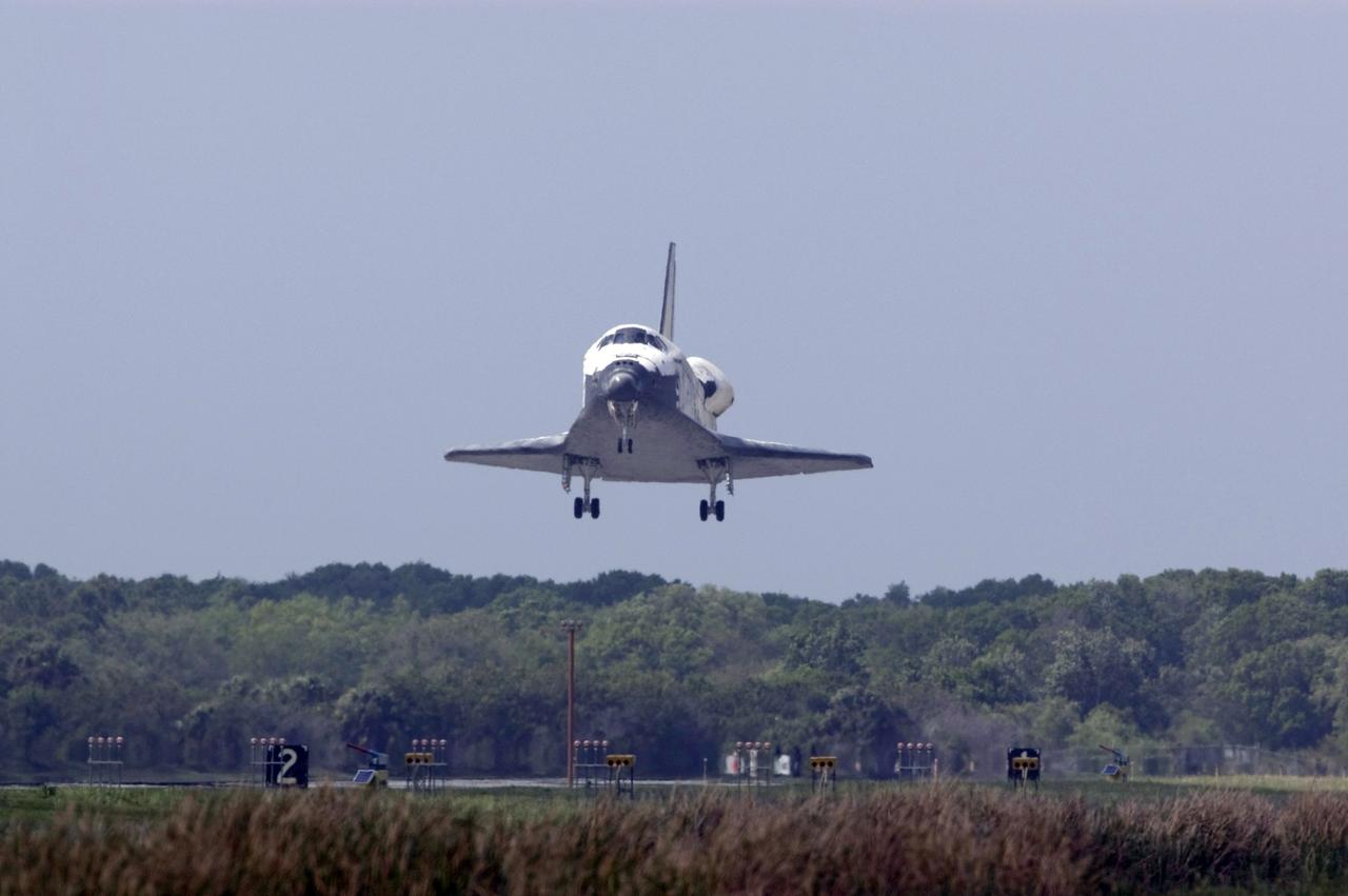 CAPE CANAVERAL, Fla. – Space shuttle Discovery approaches Runway 15 at NASA's Kennedy Space Center in Florida to complete the 13-day, 5.3-million mile journey on the STS-119 mission to the International Space Station. Main gear touchdown was at 3:13:17 p.m. EDT. Nose gear touchdown was at 3:13:40 p.m. and wheels stop was at 3:14:45 p.m. Discovery delivered the final pair of large power-generating solar array wings and the S6 truss segment. The mission was the 28th flight to the station, the 36th flight of Discovery and the 125th in the Space Shuttle Program, as well as the 70th landing at Kennedy. Photo credit: NASA/Kevin O'Connell