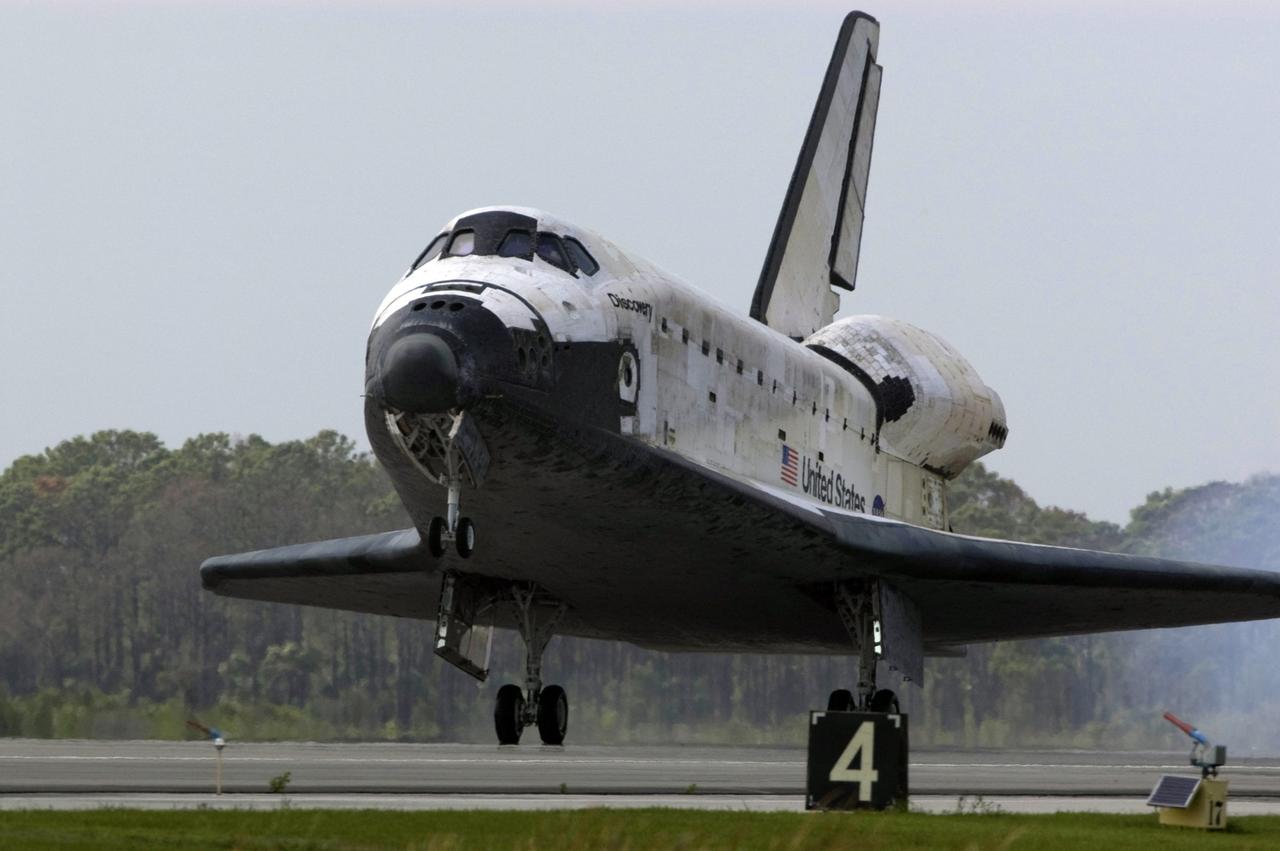CAPE CANAVERAL, Fla. – Space shuttle Discovery touches down on Runway 15 at NASA's Kennedy Space Center in Florida to complete the 13-day, 5.3-million mile journey on the STS-119 mission to the International Space Station. Main gear touchdown was at 3:13:17 p.m. EDT. Nose gear touchdown was at 3:13:40 p.m. and wheels stop was at 3:14:45 p.m. Discovery delivered the final pair of large power-generating solar array wings and the S6 truss segment. The mission was the 28th flight to the station, the 36th flight of Discovery and the 125th in the Space Shuttle Program, as well as the 70th landing at Kennedy. Photo credit: NASA/Kevin O'Connell