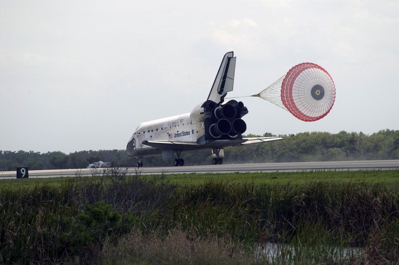 CAPE CANAVERAL, Fla. – With the aid of a drogue chute, space shuttle Discovery slows to a stop on Runway 15 at NASA's Kennedy Space Center in Florida to complete the 13-day, 5.3-million mile journey on the STS-119 mission to the International Space Station. Main gear touchdown was at 3:13:17 p.m. EDT. Nose gear touchdown was at 3:13:40 p.m. and wheels stop was at 3:14:45 p.m. Discovery delivered the final pair of large power-generating solar array wings and the S6 truss segment. The mission was the 28th flight to the station, the 36th flight of Discovery and the 125th in the Space Shuttle Program, as well as the 70th landing at Kennedy. Photo credit: NASA/Kevin O'Connell