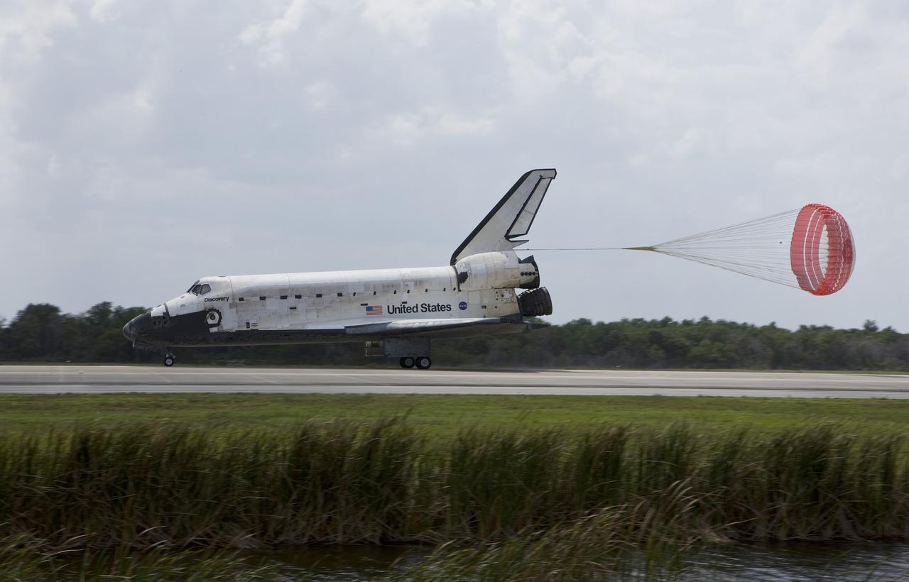 CAPE CANAVERAL, Fla. – The drogue chute unfurls behind space shuttle Discovery on Runway 15 at NASA's Kennedy Space Center in Florida. Landing of Discovery March 28, 2009, completed the 13-day, 5.3-million mile journey on the STS-119 mission to the International Space Station. Main gear touchdown was at 3:13:17 p.m. EDT. Nose gear touchdown was at 3:13:40 p.m. and wheels stop was at 3:14:45 p.m. Discovery delivered the final pair of large power-generating solar array wings and the S6 truss segment. The mission was the 28th flight to the station, the 36th flight of Discovery and the 125th in the Space Shuttle Program, as well as the 70th landing at Kennedy. Photo courtesy of Scott Andrews, Canon