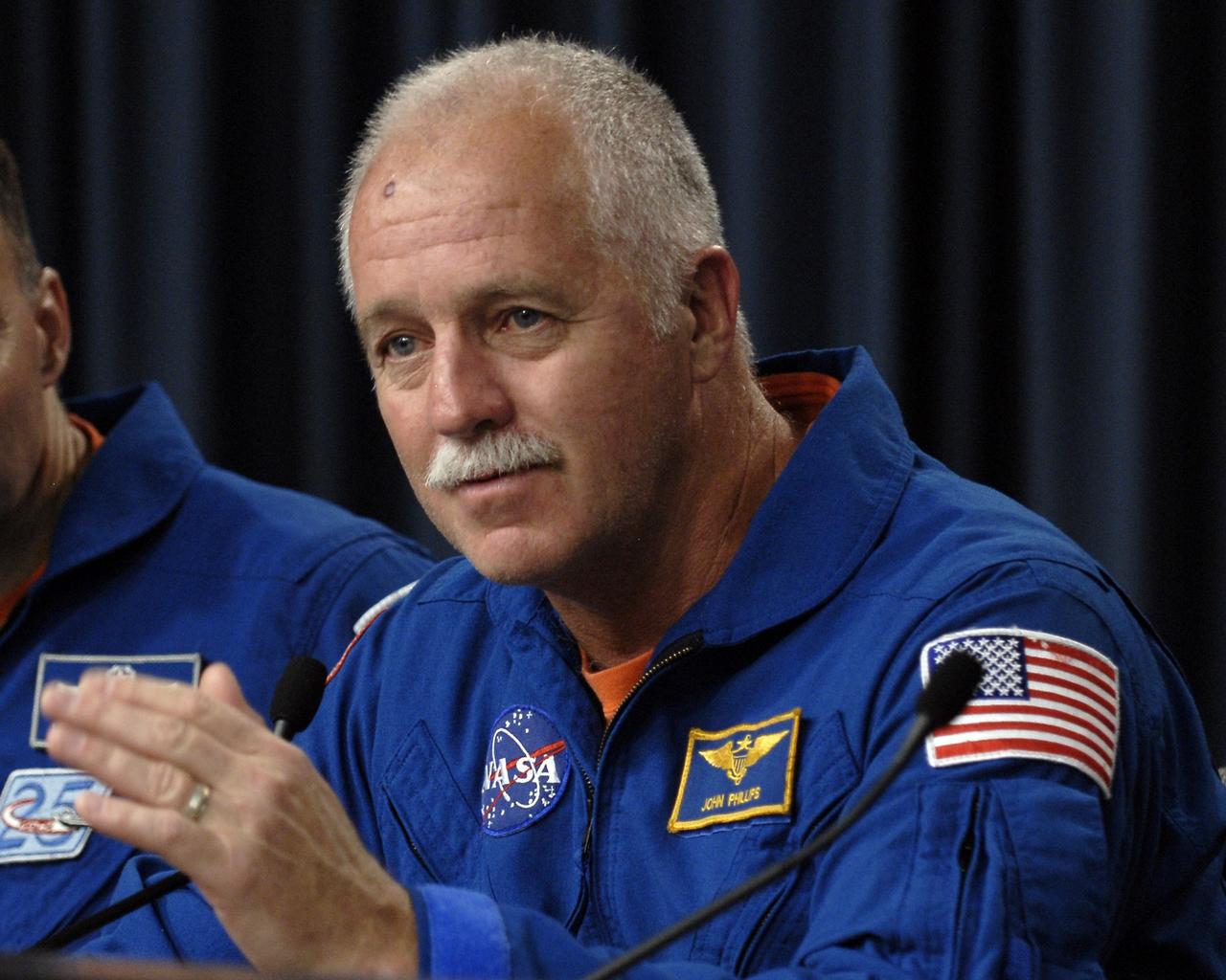 CAPE CANAVERAL, Fla. – At NASA's Kennedy Space Center in Florida, STS-119 Mission Specialist John Phillips answers a question from the media during a news conference following landing of the space shuttle Discovery STS-119 mission to the International Space Station. Main gear touchdown was at 3:13:17 p.m. EDT. Nose gear touchdown was at 3:13:40 p.m. and wheels stop was at 3:14:45 p.m. Discovery delivered the final pair of large power-generating solar array wings and the S6 truss segment. The mission was the 28th flight to the station, the 36th flight of Discovery and the 125th in the Space Shuttle Program, as well as the 70th landing at Kennedy. Photo credit: NASA/Kim Shiflett