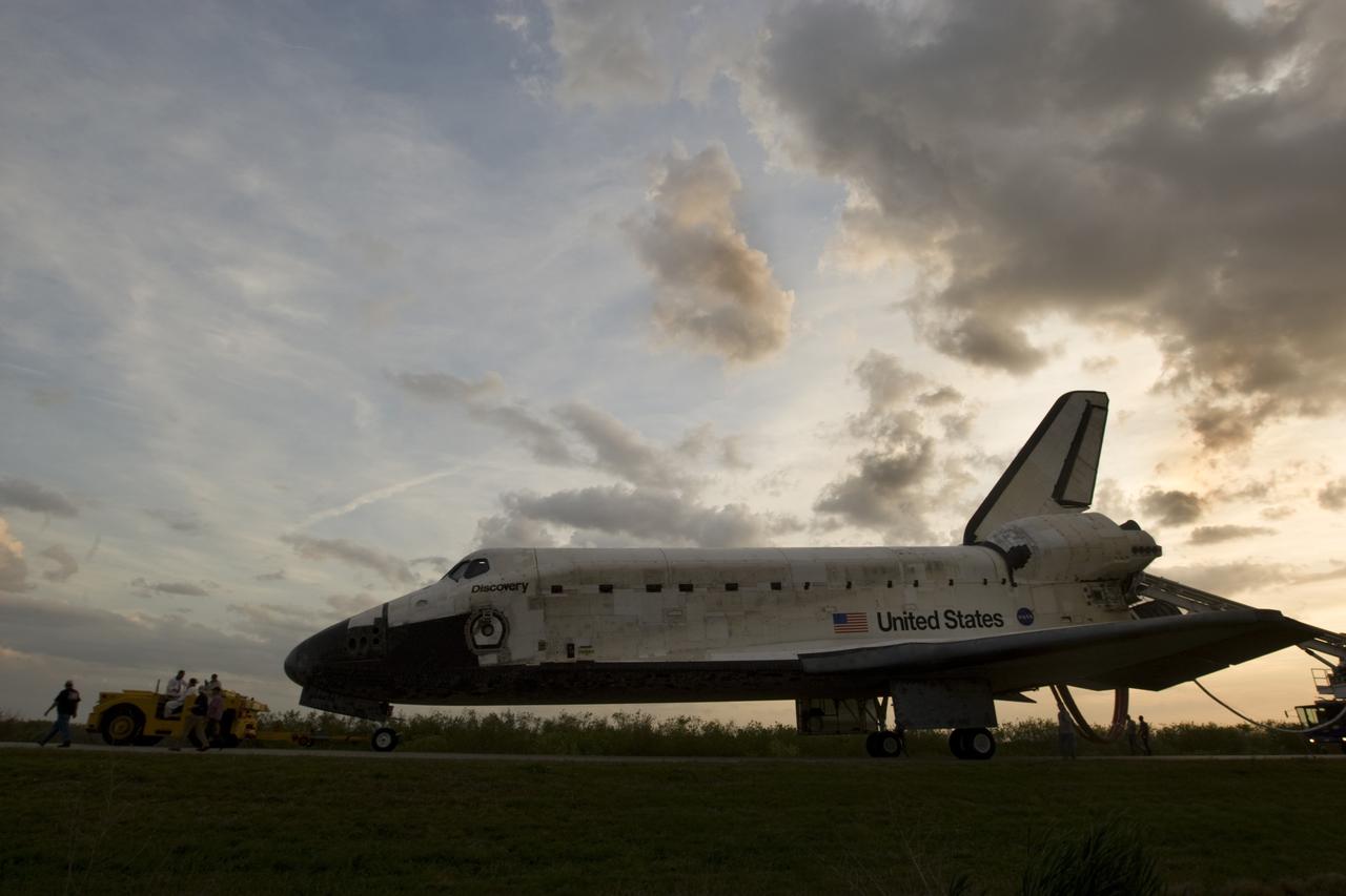 CAPE CANAVERAL, Fla. – Space shuttle Discovery is towed to Orbiter Processing Facility-3 following touchdown on Runway 15 at NASA's Kennedy Space Center in Florida to complete the 13-day, 5.3-million mile journey of the STS-119 mission to the International Space Station.  Main gear touchdown was at 3:13:17 p.m. EDT.  Nose gear touchdown was at 3:13:40 p.m. and wheels stop was at 3:14:45 p.m.  Discovery delivered the final pair of large power-generating solar array wings and the S6 truss segment. The mission was the 28th flight to the station, the 36th flight of Discovery and the 125th in the Space Shuttle Program, as well as the 70th landing at Kennedy. Photo courtesy of Scott Andrews, Canon