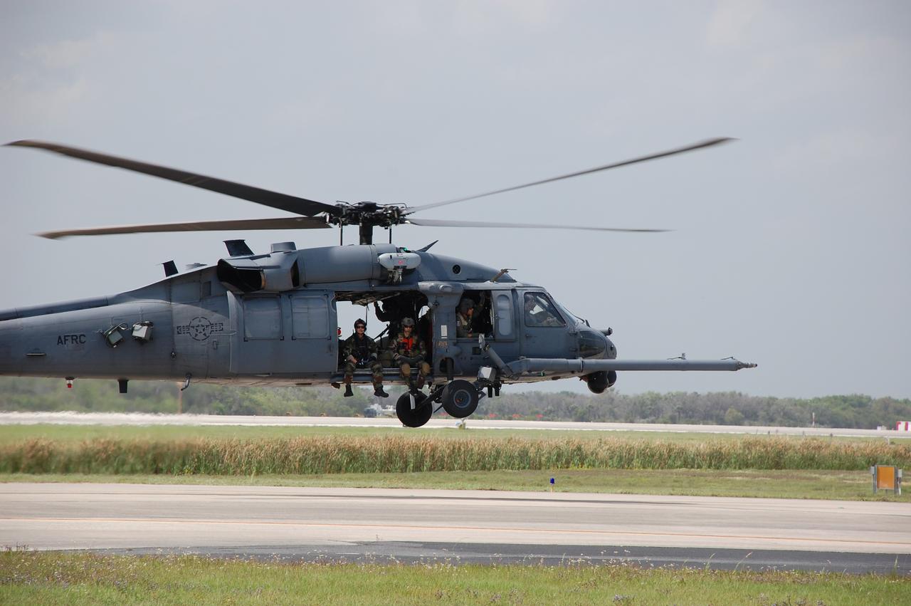 CAPE CANAVERAL, Fla. – Medical personnel aboard a helicopter arrive at the Shuttle Landing Facility at NASA's Kennedy Space Center in Florida before space shuttle Discovery's landing.  Discovery returned from a 13-day journey of more than 5.3 million miles on the STS-119 mission. The STS-119 flight delivered the space station's fourth and final set of large solar array wings and the S6 truss segment, completing the station's truss, or backbone. The additional electricity provided by the arrays will fully power science experiments and help support six-person station operations in May. The mission was the 28th flight to the station, the 36th flight of Discovery and the 125th in the Space Shuttle Program, as well as the 70th landing at Kennedy.  Photo credit: NASA/Ben Smegelsky