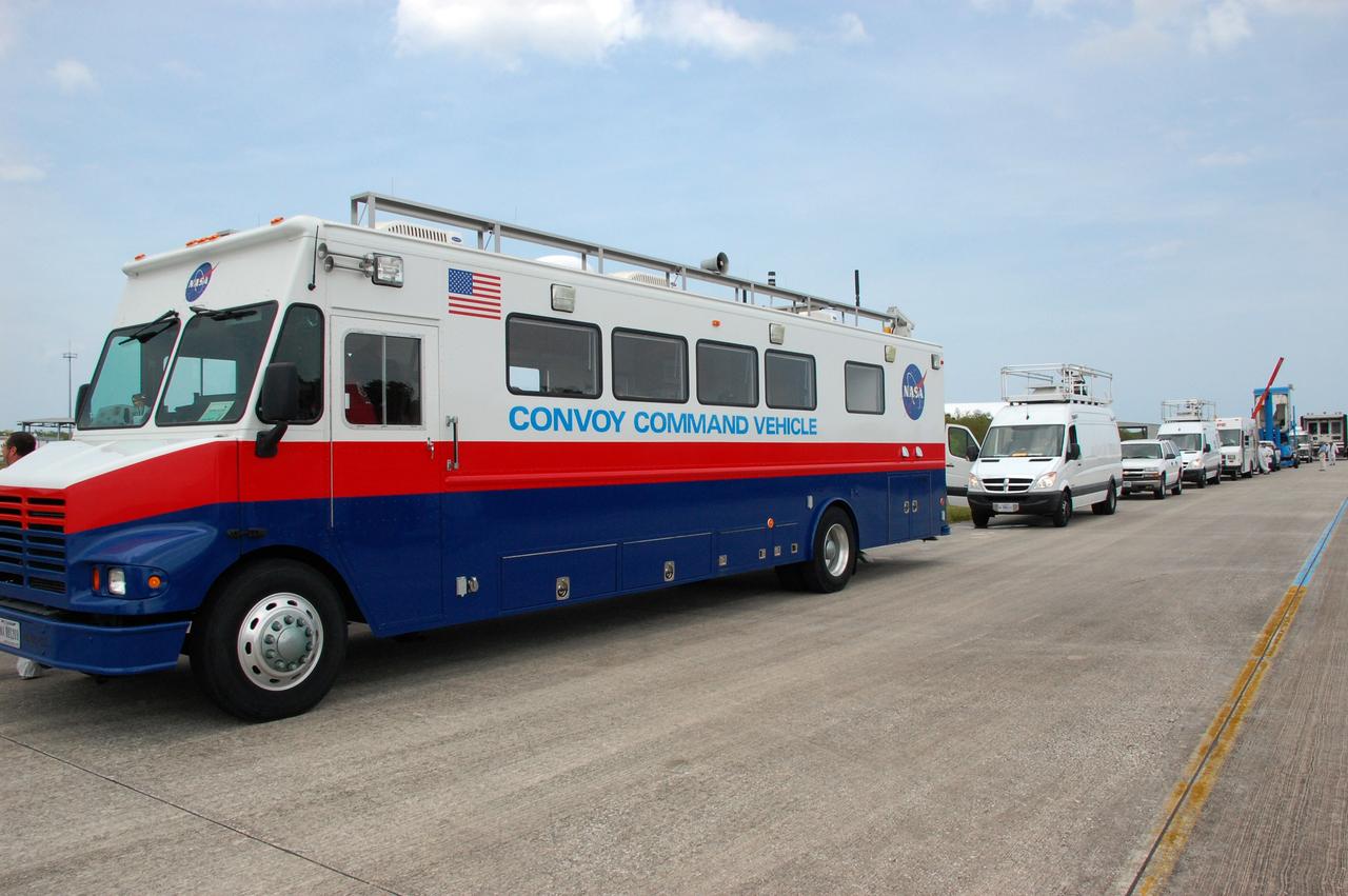 CAPE CANAVERAL, Fla. – The landing convoy is lined up on the Shuttle Landing Facility runway at NASA's Kennedy Space Center in Florida.  The convoy awaits space shuttle Discovery's landing, after completing itsa 13-day journey of more than 5.3 million miles on the STS-119 mission. At left is the Convoy Command Vehicle which is the command post for the convoy commander. the convoy commander is in communication with the shuttle and all of the landing convoy vehicles during the post-landing operations. The landing convoy's purpose is to safe the vehicle and provide support for the disembarking crew and experiments.  The STS-119 flight delivered the space station's fourth and final set of large solar array wings and the S6 truss segment, completing the station's truss, or backbone. The additional electricity provided by the arrays will fully power science experiments and help support six-person station operations in May. The mission was the 28th flight to the station, the 36th flight of Discovery and the 125th in the Space Shuttle Program, as well as the 70th landing at Kennedy.  Photo credit: NASA/Ben Smegelsky