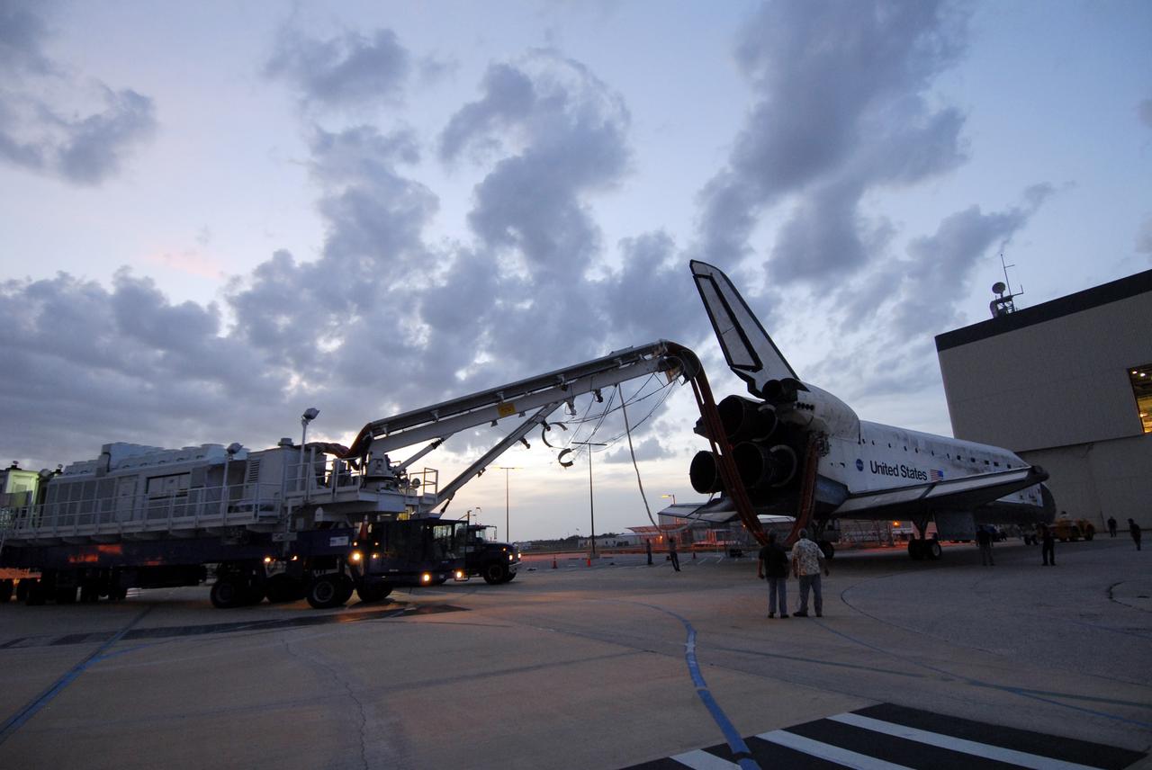 CAPE CANAVERAL, Fla. – Space shuttle Discovery rolls toward Orbiter Processing Facility 3 at NASA's Kennedy Space Center in Florida. Discovery landed at 3:13:17 p.m. EDT after completing a 13-day journey of more than 5.3 million miles on the STS-119 mission. The mission was the 28th flight to the station, the 36th flight of Discovery and the 125th in the Space Shuttle Program, as well as the 70th landing at Kennedy. Photo credit: NASA/Jack Pfaller
