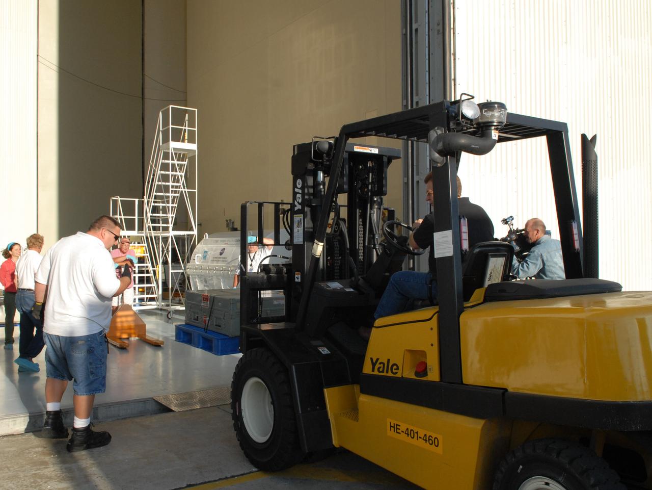 CAPE CANAVERAL, Fla. – The Science Instrument Command and Data Handling Unit, or SIC&DH, is transferred inside the Payload Hazardous Servicing Facility at NASA's Kennedy Space Center in Florida. The SIC&DH will be installed on the Hubble Space Telescope during space shuttle Atlantis' STS-125 mission. This unit will replace the one that suffered a failure aboard the orbiting telescope on Sept. 27, 2008.  The SIC&DH is being prepared for integration onto the Multi-Use Lightweight Equipment Carrier .The carrier holds the payload for space shuttle Atlantis' STS-125 mission servicing NASA's Hubble Space Telescope, targeted to launch May 12.  Photo credit: NASA/Jack Pfaller