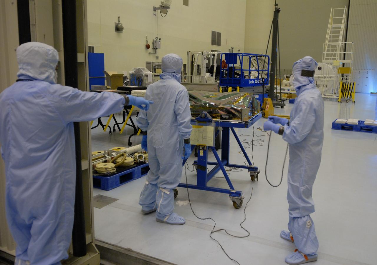 CAPE CANAVERAL, Fla. – In the Payload Hazardous Servicing Facility at NASA's Kennedy Space Center in Florida, the Science Instrument Command and Data Handling Unit, or SIC&DH, is moved into a clean area. The SIC&DH will be installed on the Hubble Space Telescope during space shuttle Atlantis' STS-125 mission, replacing the one that suffered a failure aboard the orbiting telescope on Sept. 27, 2008. The SIC&DH is being prepared for integration onto the Multi-Use Lightweight Equipment Carrier. The SIC&DH will be installed on the Hubble Space Telescope during space shuttle Atlantis' STS-125 mission, replacing one that suffered a failure aboard the orbiting telescope on Sept. 27, 2008. The carrier holds the payload for space shuttle Atlantis' STS-125 mission servicing NASA's Hubble Space Telescope, targeted to launch May 12.  Photo credit: NASA/Jack Pfaller