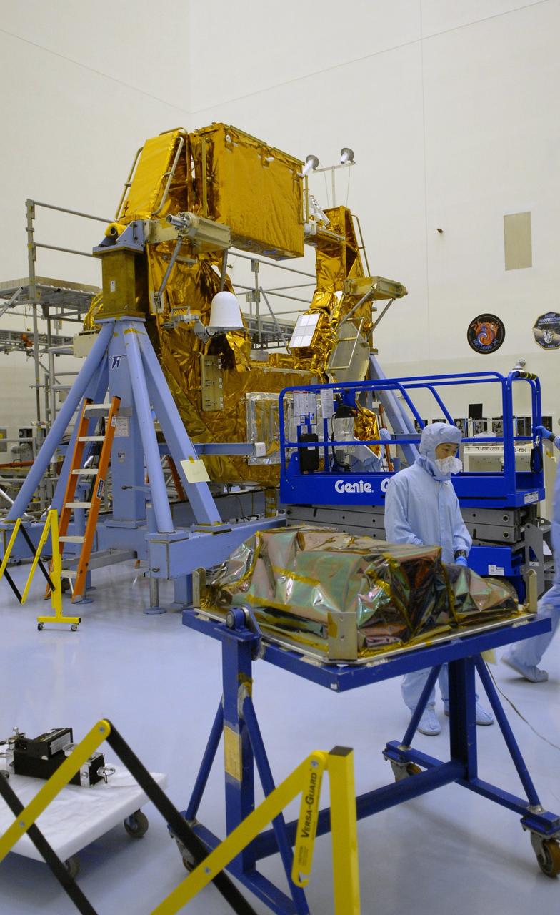 CAPE CANAVERAL, Fla. – In the clean area of the Payload Hazardous Servicing Facility at NASA's Kennedy Space Center in Florida, the Science Instrument Command and Data Handling Unit, or SIC&DH, in the foreground, is being prepared for integration onto the Multi-Use Lightweight Equipment Carrier, in the background.  The SIC&DH will be installed on the Hubble Space Telescope during space shuttle Atlantis' STS-125 mission, replacing the one that suffered a failure aboard the orbiting telescope on Sept. 27, 2008.   The SIC&DH will be installed on the Hubble Space Telescope during space shuttle Atlantis' STS-125 mission, replacing one that suffered a failure aboard the orbiting telescope on Sept. 27, 2008. The carrier holds the payload for space shuttle Atlantis' STS-125 mission servicing NASA's Hubble Space Telescope, targeted to launch May 12.  Photo credit: NASA/Jack Pfaller