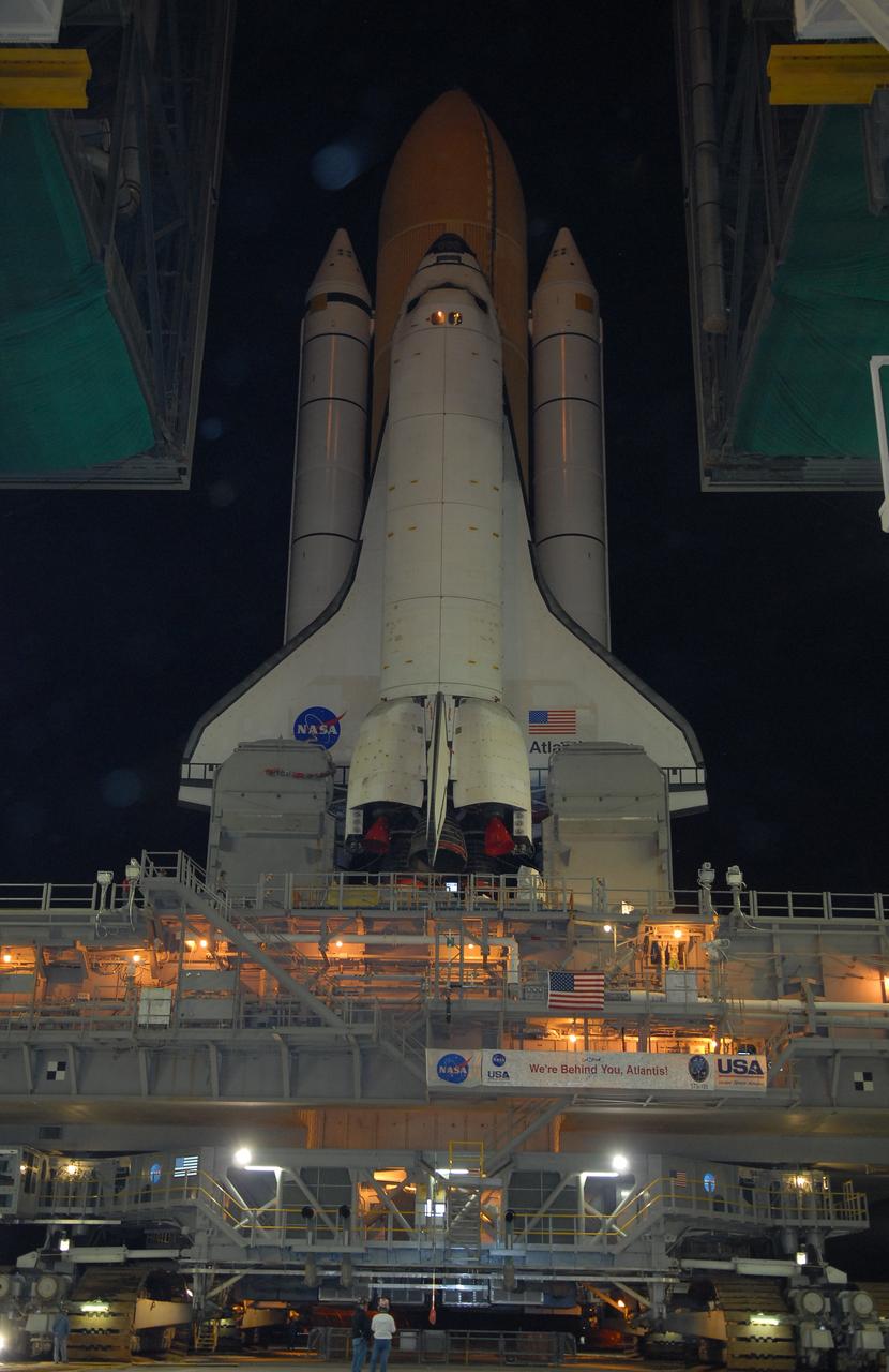 CAPE CANAVERAL, Fla. – Space shuttle Atlantis moves through the open door of the Vehicle Assembly Building  at NASA's Kennedy Space Center in Florida to roll out to Launch Pad 39A.   Atlantis is targeted to lift off May 12 to service NASA's Hubble Space Telescope. First motion was at 3:54 a.m. EDT. The 3.4-mile trip will take about six hours. During Atlantis' 11-day mission, the crew of seven astronauts will make the final shuttle flight to Hubble. During five spacewalks, they will install two new instruments, repair two inactive ones and replace components. The result will be six working, complementary science instruments with capabilities beyond what is now available, and an extended operational lifespan for the telescope through at least 2014.   Photo credit: NASA/Jack Pfaller