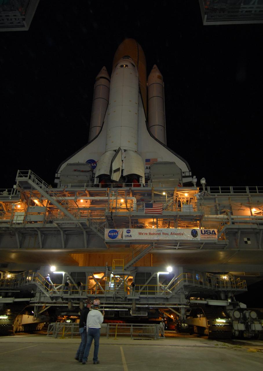CAPE CANAVERAL, Fla. – Space shuttle Atlantis moves through the open door of the Vehicle Assembly Building  at NASA's Kennedy Space Center in Florida to roll out to Launch Pad 39A.  Atlantis is targeted to lift off May 12 to service NASA's Hubble Space Telescope. First motion was at 3:54 a.m. EDT. The 3.4-mile trip will take about six hours. During Atlantis' 11-day mission, the crew of seven astronauts will make the final shuttle flight to Hubble. During five spacewalks, they will install two new instruments, repair two inactive ones and replace components. The result will be six working, complementary science instruments with capabilities beyond what is now available, and an extended operational lifespan for the telescope through at least 2014.   Photo credit: NASA/Jack Pfaller
