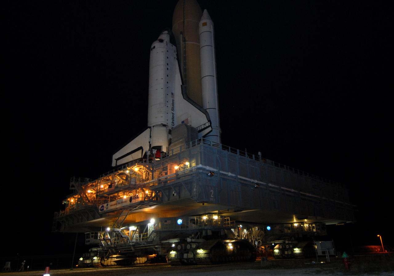 CAPE CANAVERAL, Fla. – Space shuttle Atlantis moves along the crawlerway at NASA's Kennedy Space Center in Florida on its rollout to Launch Pad 39A.  Atlantis is targeted to lift off May 12 to service NASA's Hubble Space Telescope. First motion was at 3:54 a.m. EDT. The 3.4-mile trip will take about six hours. During Atlantis' 11-day mission, the crew of seven astronauts will make the final shuttle flight to Hubble. During five spacewalks, they will install two new instruments, repair two inactive ones and replace components. The result will be six working, complementary science instruments with capabilities beyond what is now available, and an extended operational lifespan for the telescope through at least 2014.   Photo credit: NASA/Jack Pfaller